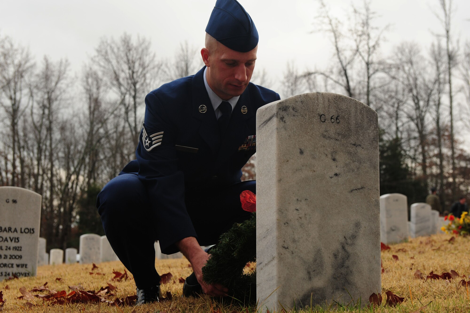 Staff Sgt. Kristopher Dolehanty, a 19th Civil Engineer Squadron heating, ventilation, and air conditioning craftsman, places a wreath at the gravesite of a fallen service member Dec. 15, 2012, at the Arkansas State Veterans Cemetery in North Little Rock, Ark. Dolehanty volunteered to be a wreath layer in the official Wreaths Across America ceremony. (U.S. Air Force photo by Airman 1st Class Kaylee Clark)