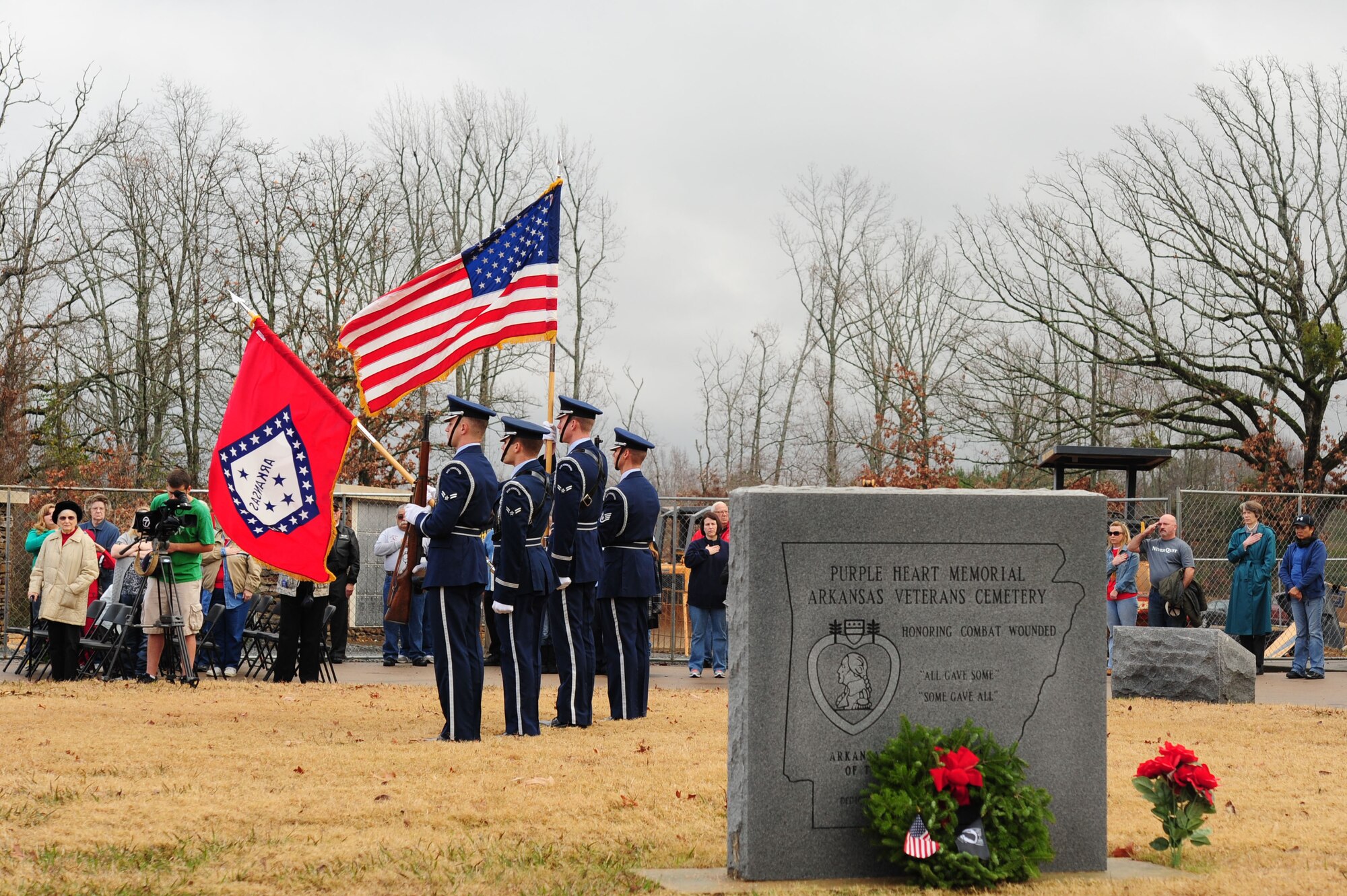 The Little Rock Air Force Base Honor Guard presents the colors, concluding the Wreaths Across America ceremony, Dec. 15, 2012, at the Arkansas State Veterans Cemetery in North Little Rock, Ark. More than 400,000 wreaths were placed nationwide, by over 150,000 volunteers as part of the Wreaths Across America’s mission. (U.S. Air Force photo by Airman 1st Class Kaylee Clark)