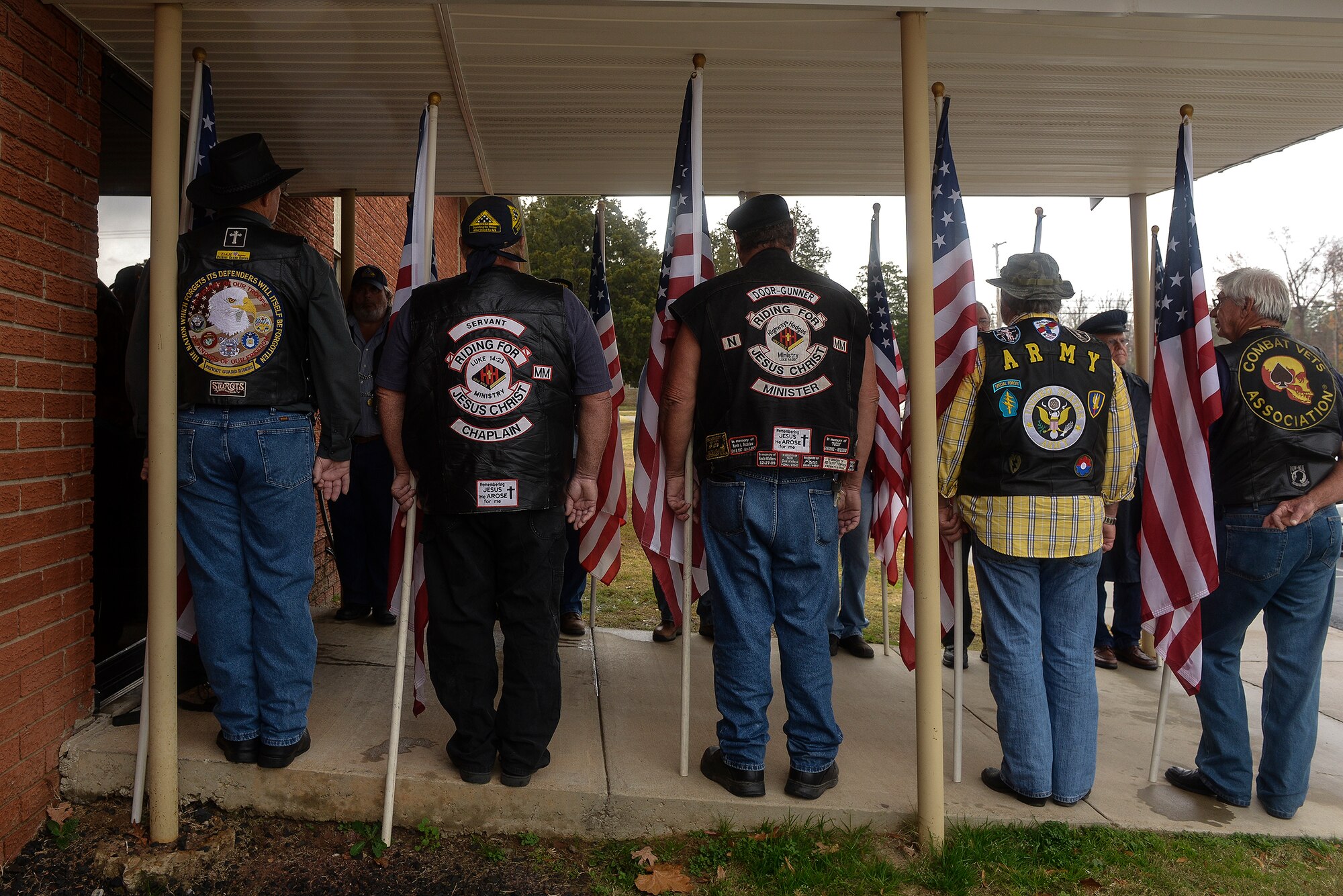 Members of the Patriot Guard Riders form a flag line outside of Cedar Heights Baptist Church in North Little Rock, Ark. on Dec. 4, 2012. The Patriot Guard was invited to honor a deceased World War II veteran. (U.S. Air Force photo by Staff Sgt. Russ Scalf)
