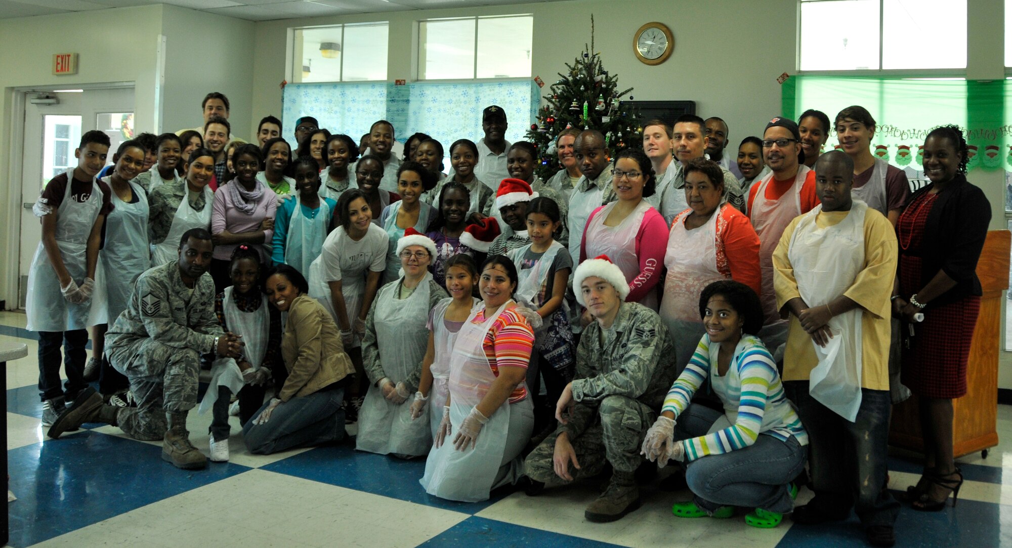 Volunteers of the Chapman Partnership's Christmas mean in Homestead, Fla., Dec. 25. Several members of Homestead Air Reserve Base, Fla., organized by the base's Unit Advisory Council, volunteered to help the Chapman Partnership, a local organization which provides comprehensive services to the homeless, during their Christmas meal. Homestead ARB has also participated with Chapman Partnership on other events such as food drives and holiday events. (U.S. Air Force photo/Senior Airman Jaimi Upthegrove)