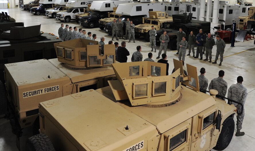 MINOT AIR FORCE BASE, N.D. -- Col. Kevin Cullen, 91st Security Forces Group commander, and Col. William Mazzeno, 5th Mission Support Group commander, speak to the Airmen from the 5th Logistics Readiness Squadron who were responsible for the successful stand-up of the Up-Armored vehicle fleet upgrades. They thanked them for their work and contribution to the security mission of Minot Air Force Base. (U.S. Air Force photo/Senior Airman Brittany Y. Auld)