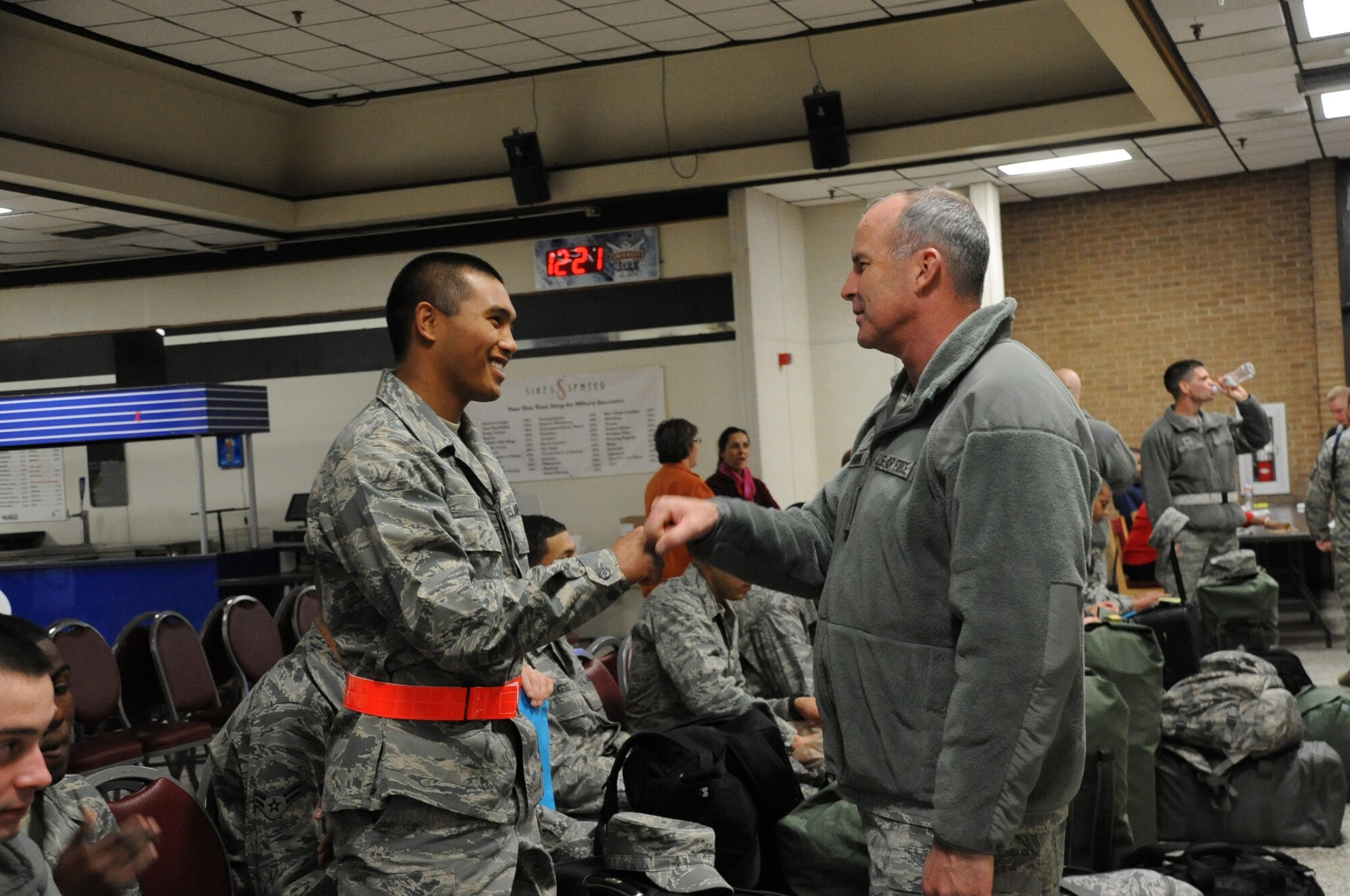 Brig. Gen. Michael Fantini, 82 TRW commander talks with Airman Ando before he left to travel home for the holidays on Dec. 21. Busses began leaving the Airman's Club for Dallas, TX at 9 p.m. with the last bus leaving at 6 a.m. (U.S. Air Force Photo/Kimberly Parker) 