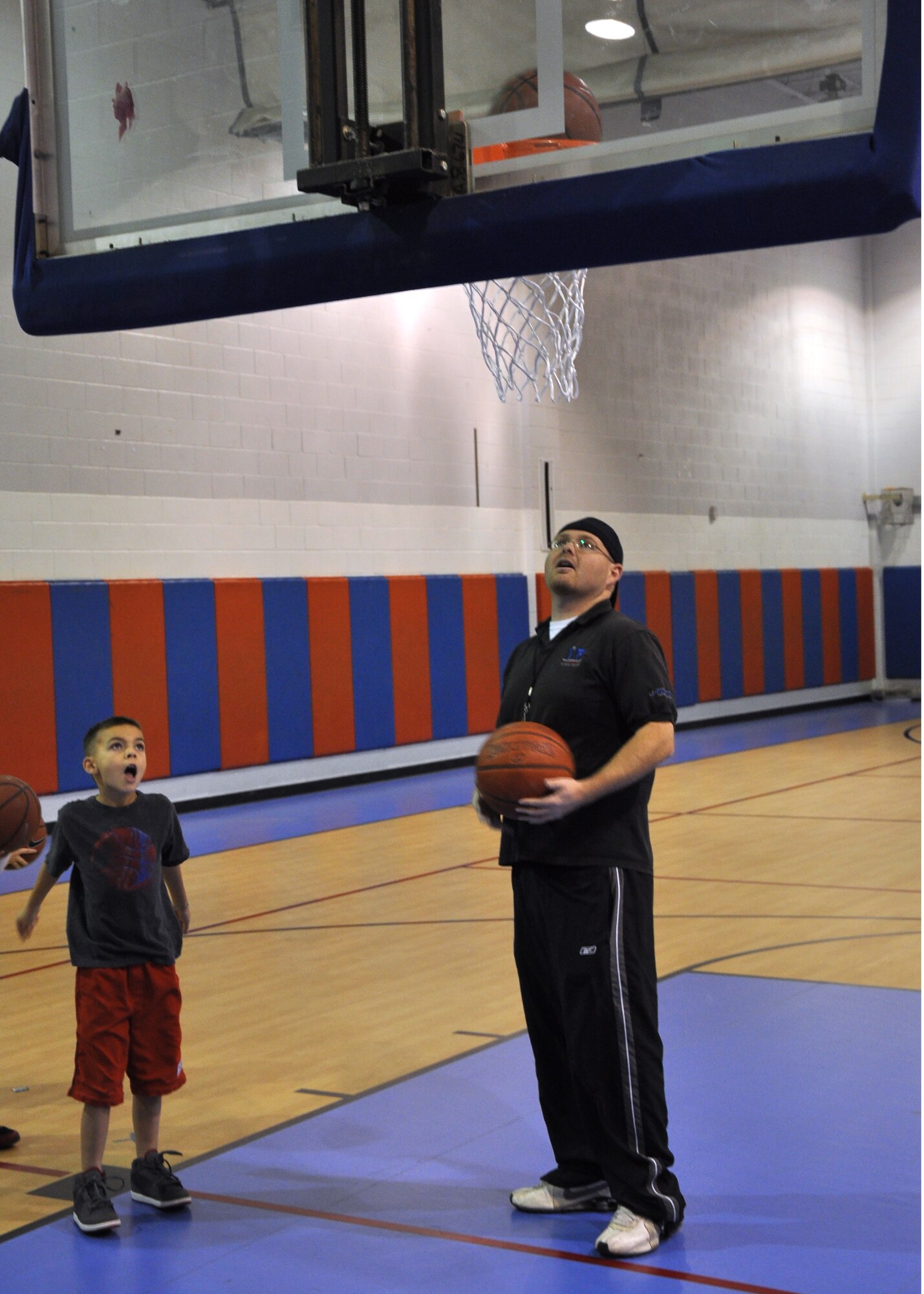 GOODFELLOW AIR FORCE BASE, Texas – Hunter Heron practices his new taught shooting skill during the Youth Basketball Camp at the Youth Center here Dec. 26. Hunter made this basket with the technique he learned from Brian Stansbury, Youth Center basketball coach. (U.S. Air Force photo/ Airman 1st Class Joshua Edwards)