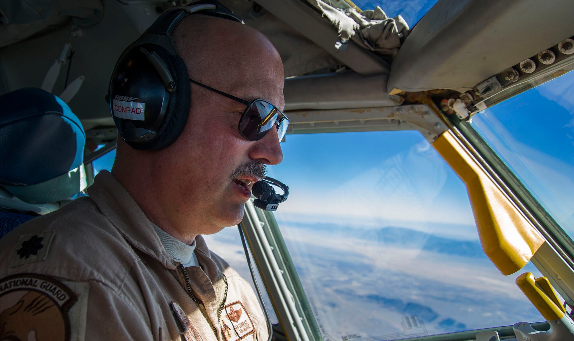 Lt. Col. Chan Conrad, 340th Expeditionary Air Refueling Squadron pilot, conducts an in-flight refueling mission on a KC-135 Stratotanker over Afghanistan, Dec. 22. During this flight the 340th EARS reached 50,000 flying hours for the year 2012. During the mission, the aircrew refueled a B-1B Lancer and an F-16 Fighting Falcon over Afghanistan in support of Operation Enduring Freedom. Conrad is deployed from Pease Air National Guard Base, N.H. and is a native of Raleigh, N.C. (US Air Force photo/Staff Sgt. Ashley Reed)