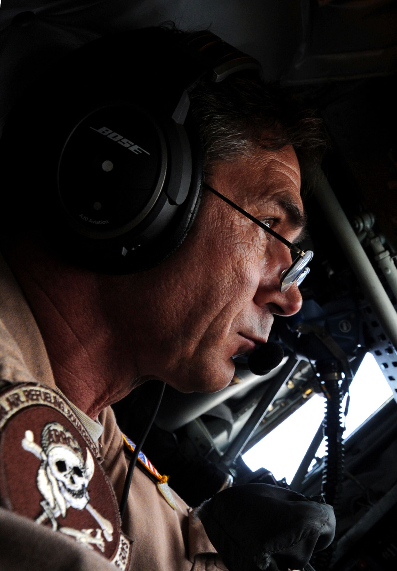 Chief Master Sgt. Robert Renn, KC-135 Stratotanker boom operator, performs an air refueling over Afghanistan, Dec. 22. During this flight the 340th EARS reached 50,000 flying hours for the year 2012. During the mission, the aircrew refueled a B-1B Lancer and an F-16 Fighting Falcon over Afghanistan in support of Operation Enduring Freedom. Renn is deployed from MacDill Air Force Base, Fla. and is a native of Tampa, Fla. (US Air Force photo/Staff Sgt. Ashley Reed)