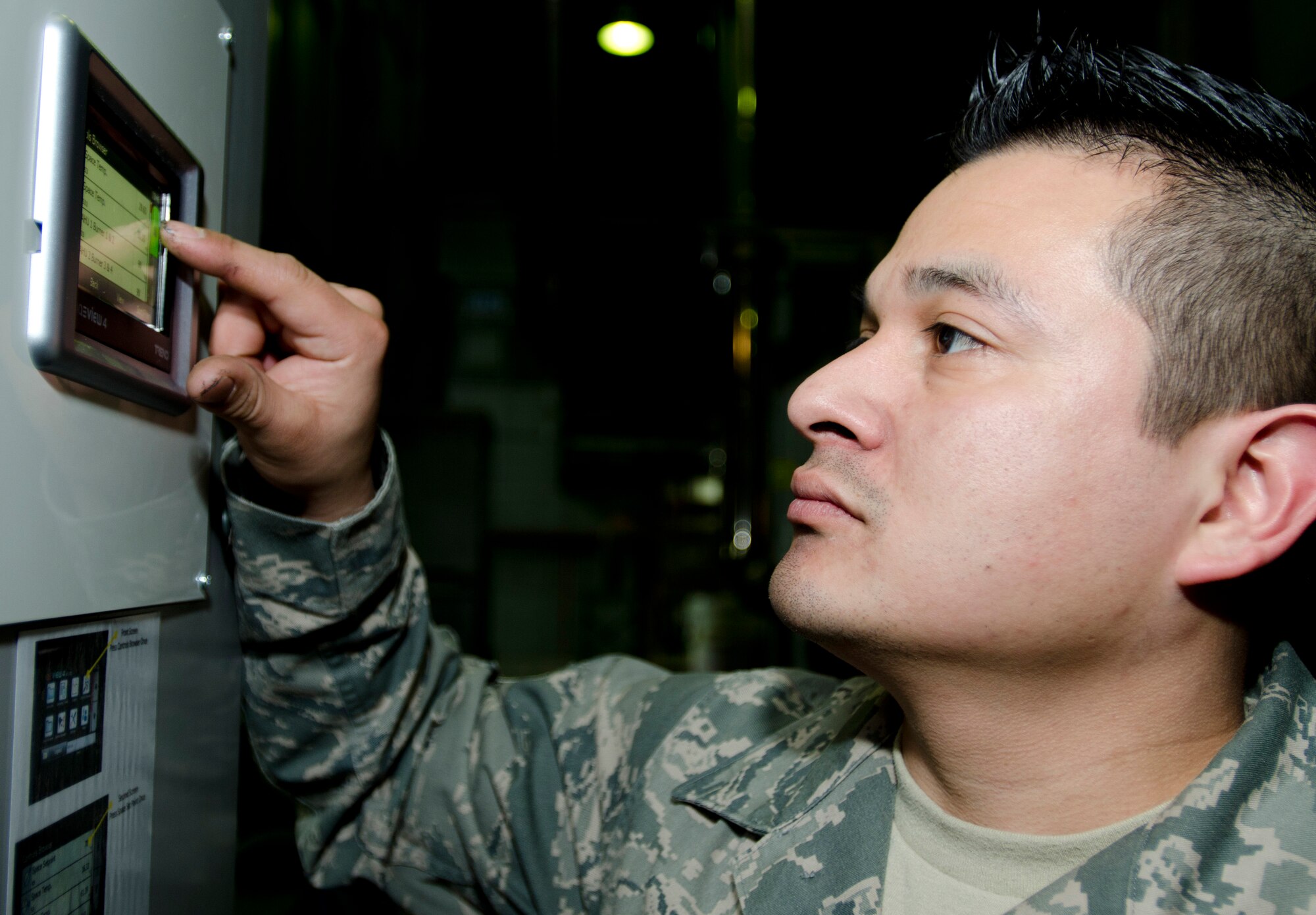 ROYAL AIR FORCE LAKENHEATH, England - Staff Sgt. Jaime Carranza, 48th Equipment Maintenance Squadron aircraft structural craftsman and native of Elsa, Texas, operates a heat exchange for a paint booth Dec. 20, 2012. The system filters air in the paint booth and keeps it at a proper temperature to ensure paint cures as quickly as possible. (U.S. Air Force photo by Staff Sgt. Stephen Linch)