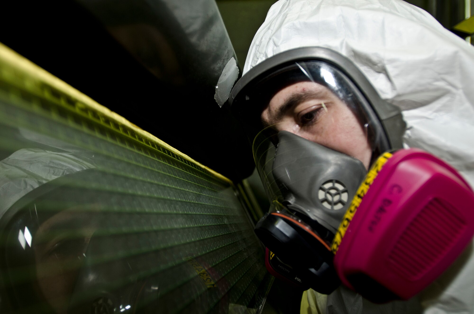 ROYAL AIR FORCE LAKENHEATH, England - Senior Airman Chris Dalton, 48th Equipment Maintenance Squadron aircraft structural journeyman and native of Astoria, Ore., sand blasts a piece of equipment Dec. 20, 2012. The 48th EMS corrosion control is responsible for ensuring all Liberty Wing aircraft and associated equipment are corrosion free and painted.  (U.S. Air Force photo by Staff Sgt. Stephen Linch)