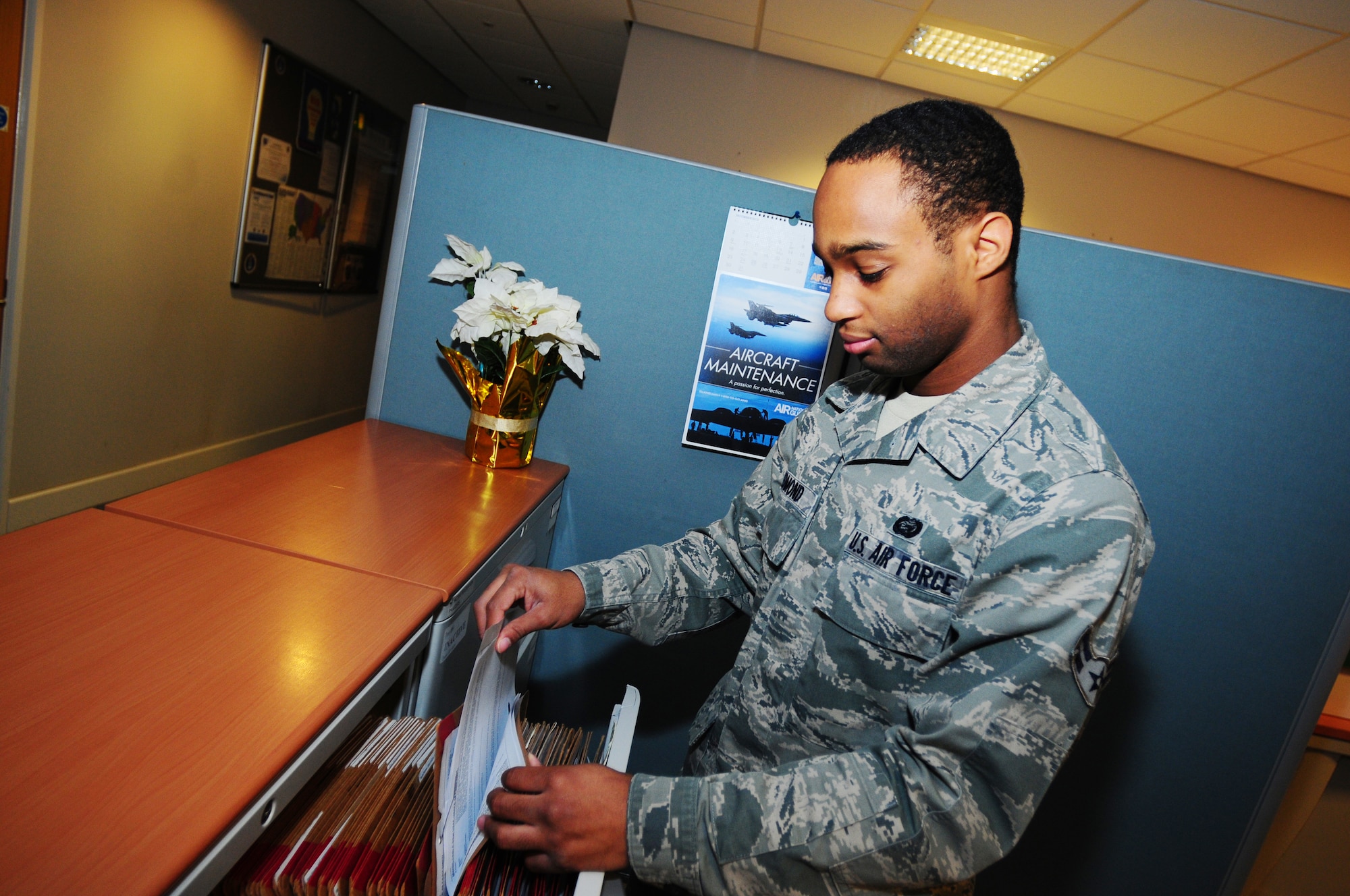 ROAYL AIR FORCE LAKENHEATH, England -- Airman 1st Class Devonte Edmond, 48th Force Support Squadron career development technician, files paperwork Dec. 27, 2012. Edmond was nominated for a Liberty Spotlight, because he displays the core value of "Service Before Self." (U.S. Air Force photo by Airman 1st Class Dana J. Butler)
