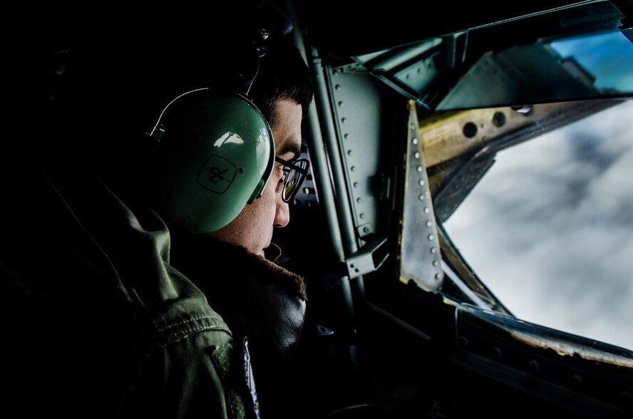 U.S. Air Force Staff Sgt. Dan Johnson, 909th Air Refueling Squadron boom operator, refuels an F-15 Eagle near Kadena Air Base, Japan, Dec. 27, 2012. The 909th ARS provides combat ready KC-135 tanker aircrews to support peacetime operations in all levels of conflict in the Pacific theater. (U.S. Air Force photo/Airman 1st Class Tyler Prince)