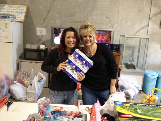 Members from the local Air Force Sergeants Association collect toys for the Misato Children’s Home in Okinawa, Japan, Dec. 21, 2012. The organization donated more than 500 toys to more than 300 children for the holidays. (Courtesy photo) 