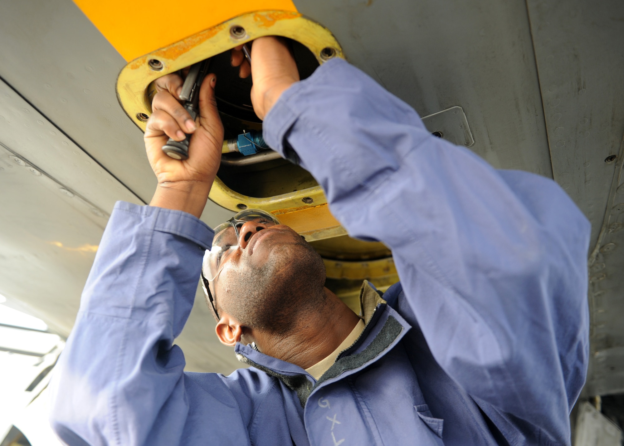SOUTHWEST ASIA - Senior Airman Quardarrius Fitts, 379th Expeditionary Maintenance Squadron fuel systems journeyman, troubleshoots a hydraulic leak on a KC-135 Dec. 26. Fitts is deployed from the 6th Maintenance Squadron at MacDill Air Force Base, Fla., and is a native of Stone Mountain, Ga. (U.S. Air Force photo/Senior Airman Joel Mease)