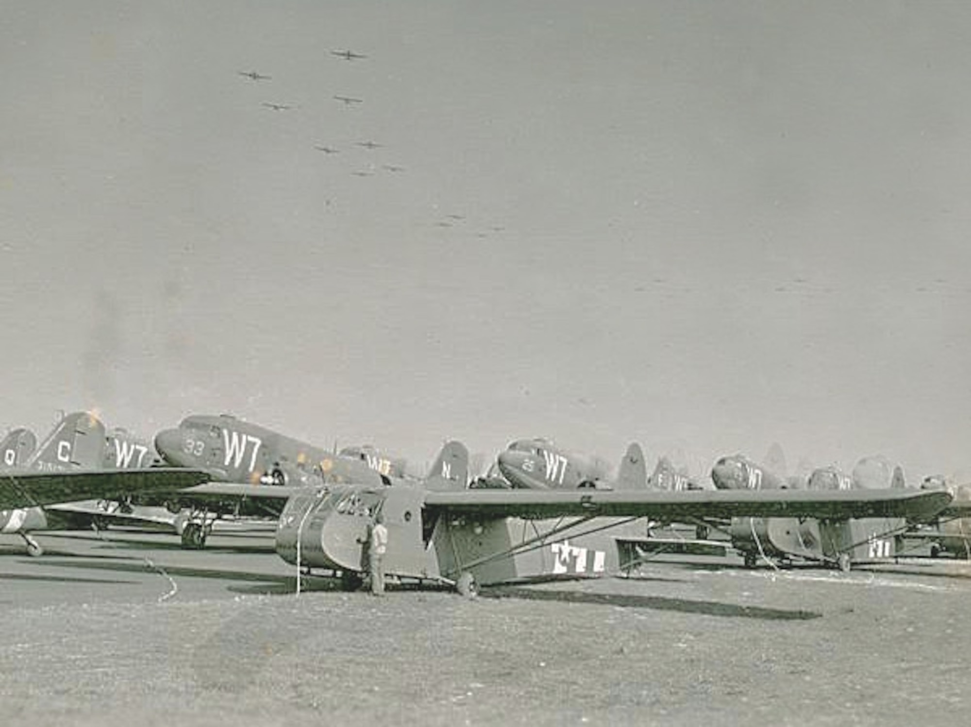 The C-47 Sky Train with the tail number 25, second back, was the plane late Army Air Force Tech Sgt. Cletis Carmean worked on during his time in the military. He served as a crew chief for that same plane during World War II, June 1944. (Courtesy photo)