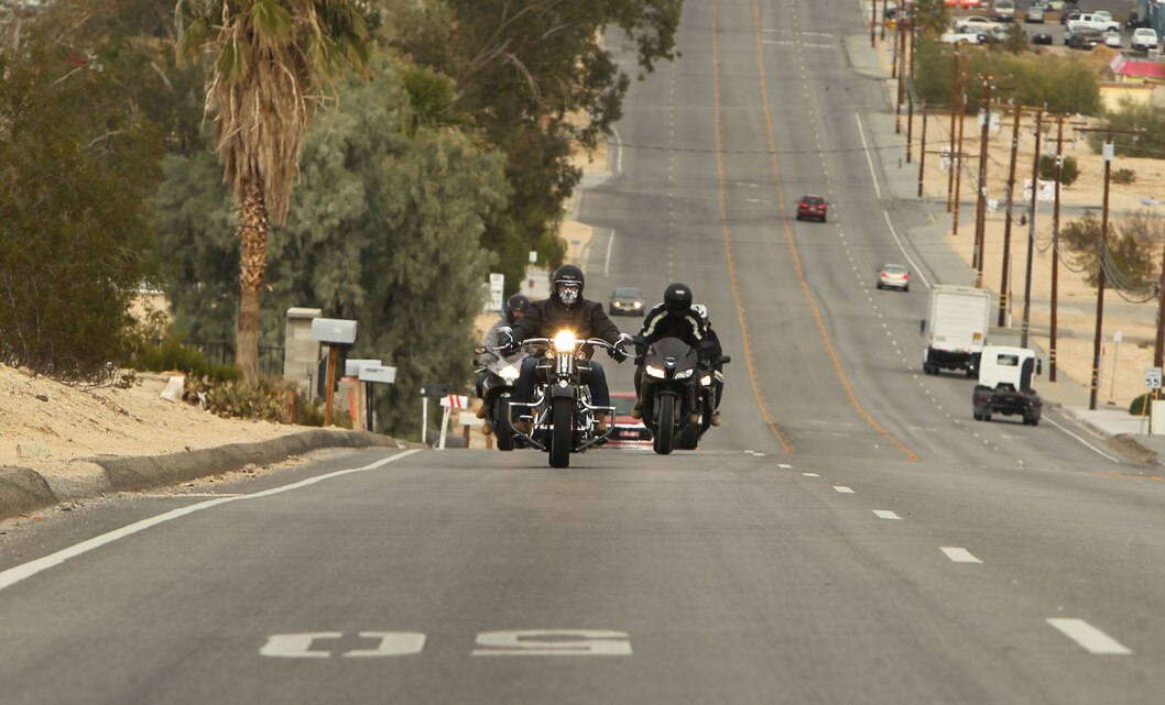 Marines with Combat Logistics Battalion 7 ride in formation down Adobe Road during a battalion motorcycle ride Dec. 12, 2012. 