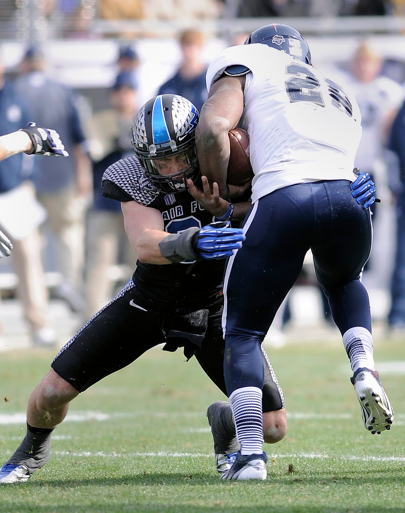 Senior defensive back Brian Lindsay stuffs Rice running back Charles Ross on a solo tackle during the Armed Forces Bowl in Fort Worth, Texas, Dec. 29, 2012. Lindsay ended the game with eight solo tackles and one assist, the third-highest among all Falcon defenders. The Falcons lost to the Owls, 33-14. (U.S. Air Force photo/Sarah Chambers)