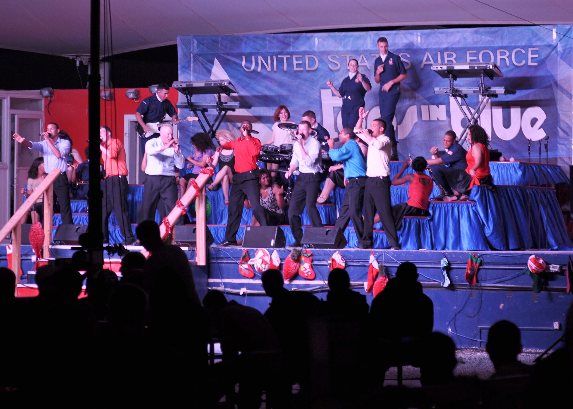 SOUTHWEST ASIA - The premier Air Force entertainment group, Tops In Blue, rocked their last show of the year for deployed coalition troops Dec. 27 at an uncdislosed location in Southwest Asia. The two-hour, outdoor event hosted nearly a thousand troops deployed overseas, and showcased a number of themed hits from jazz, country, rock and a special Christmas finale. (U.S. Air Force photo/Master Sgt. Christian Michael)