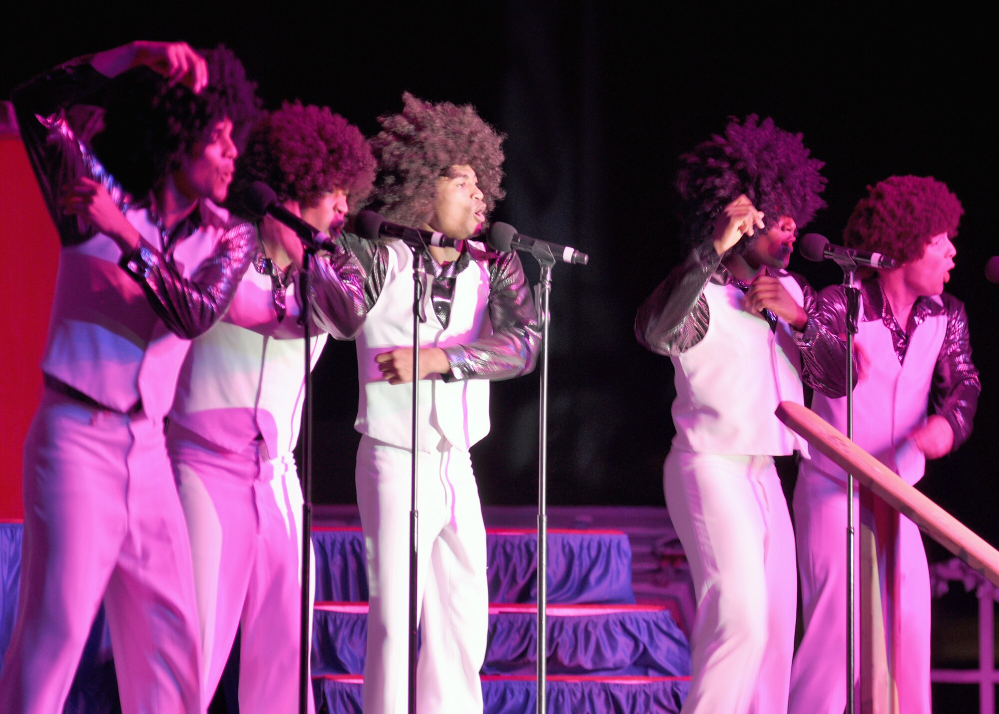 SOUTHWEST ASIA - The premier Air Force entertainment group, Tops In Blue, rocked their last show of the year for deployed coalition troops Dec. 27 at an uncdislosed location in Southwest Asia. The two-hour, outdoor event hosted nearly a thousand troops deployed overseas, and showcased a number of themed hits from jazz, country, rock and a special Christmas finale. (U.S. Air Force photo/Master Sgt. Christian Michael)
