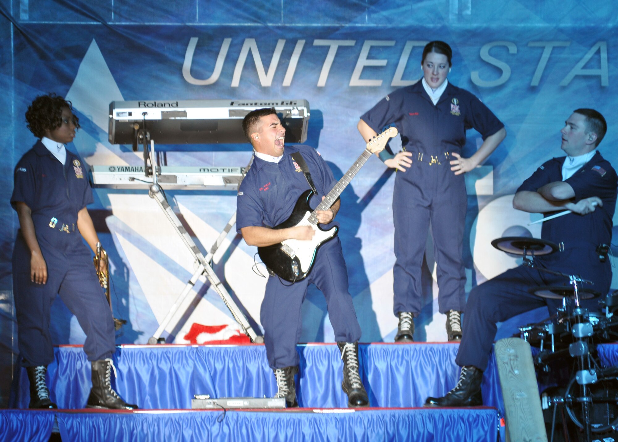SOUTHWEST ASIA - The premier Air Force entertainment group, Tops In Blue, rocked their last show of the year for deployed coalition troops Dec. 27 at an uncdislosed location in Southwest Asia. The two-hour, outdoor event hosted nearly a thousand troops deployed overseas, and showcased a number of themed hits from jazz, country, rock and a special Christmas finale. (U.S. Air Force photo/Master Sgt. Christian Michael)