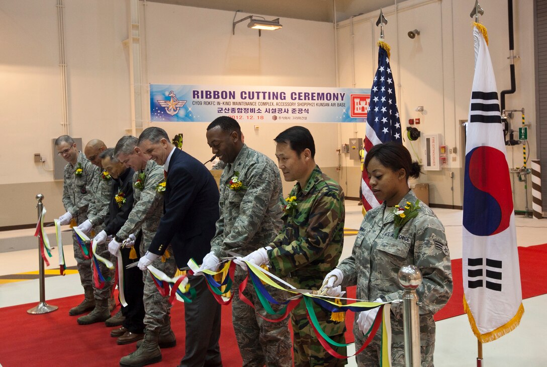 U.S. Army Corps of Engineers Far East District, 8th Fighter Wing, and other personnel cut the ribbon opening the final portion of Kunsan Air Base's new maintenance complex Dec. 18.  The new accessory shop will provide one location for aircraft components such as wheels, tires, external tanks, and hydraulic and electrical systems to be repaired or replaced.  The complex’s fabrication and armament shops were completed in 2011. The previously-completed fabrication shop includes sections for structural sheet metal, aircraft metals technology, non-destructive inspections, and survival equipment.  It also includes a state-of-the-art paint booth and sanding room.  The armament shop provides space for gun maintenance and a mission equipment storage area.  It also features administration offices, a classroom, and training room.  The project consolidates 18 shops spread around the base.  With all three now housed in one maintenance facility close to the flight line, the response time to urgent aircraft maintenance issues is greatly reduced.
