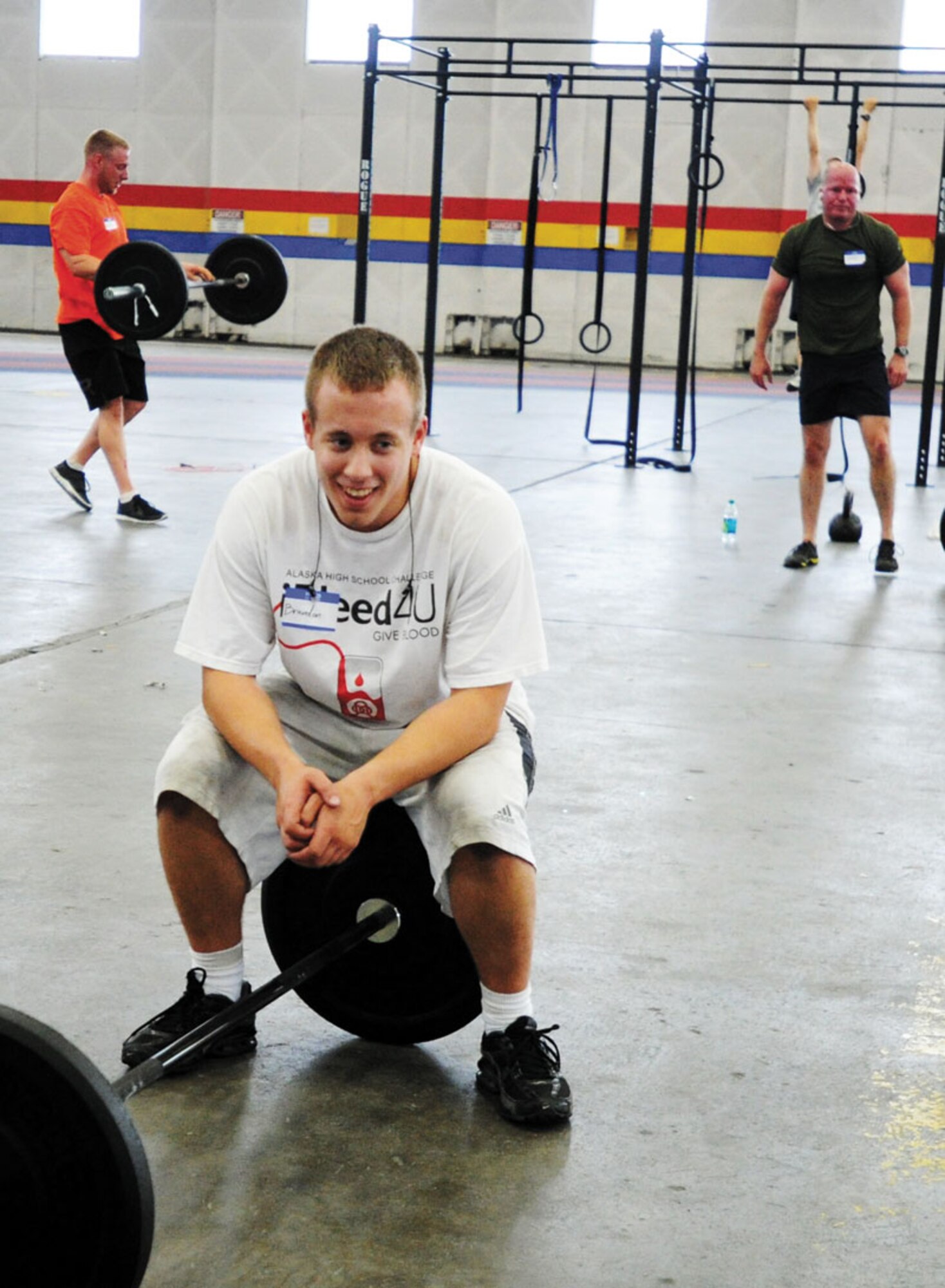 Airmen, Soldiers and civilians participate in a Crossfit fitness program at Hangar 5 on Joint Base Elmendorf-Richardson after duty hours. Fitness activities can be a wonderful outlet for stress, as well as  putting you in contact with other people who can help you when times get tough. (U.S. Air Force photo/Justin Connaher)