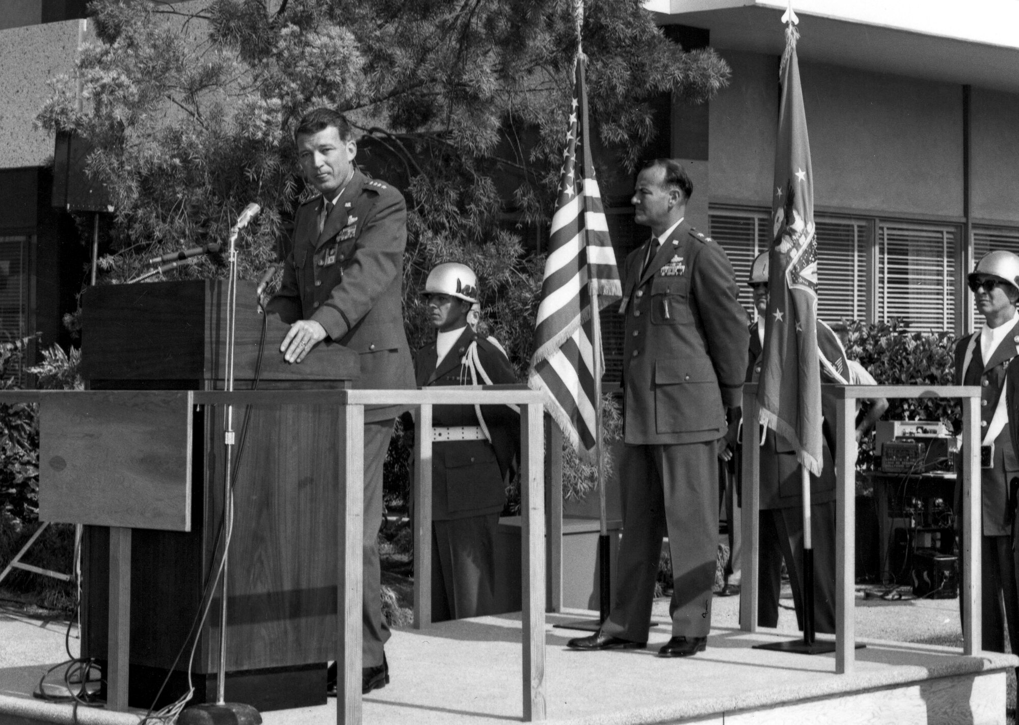 General Bernard Schriever speaks at the dedication of Los Angeles AFS in 1964. Maj. Gen. Ben Funk, Space Division commander, stands at the rear of the platform.   Funk was instrumental in establishing the base in its current location. (Photo courtesy of SMC History Office)
