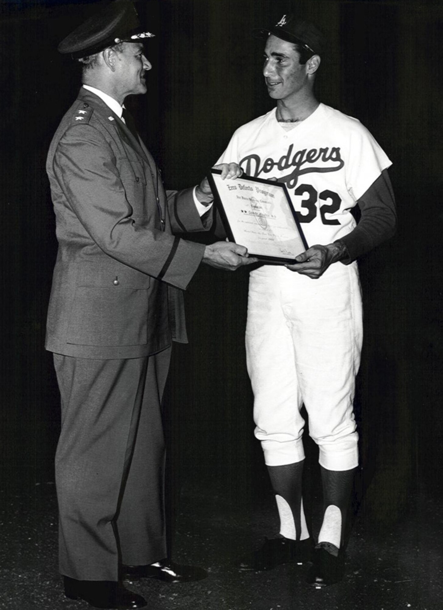 Maj. Gen.  Ben Funk presents a “Zero Defects Award” to Dodger pitcher Sandy Koufax for pitching a perfect game on Sept. 9, 1965.   (Photo courtesy of SMC History Office)