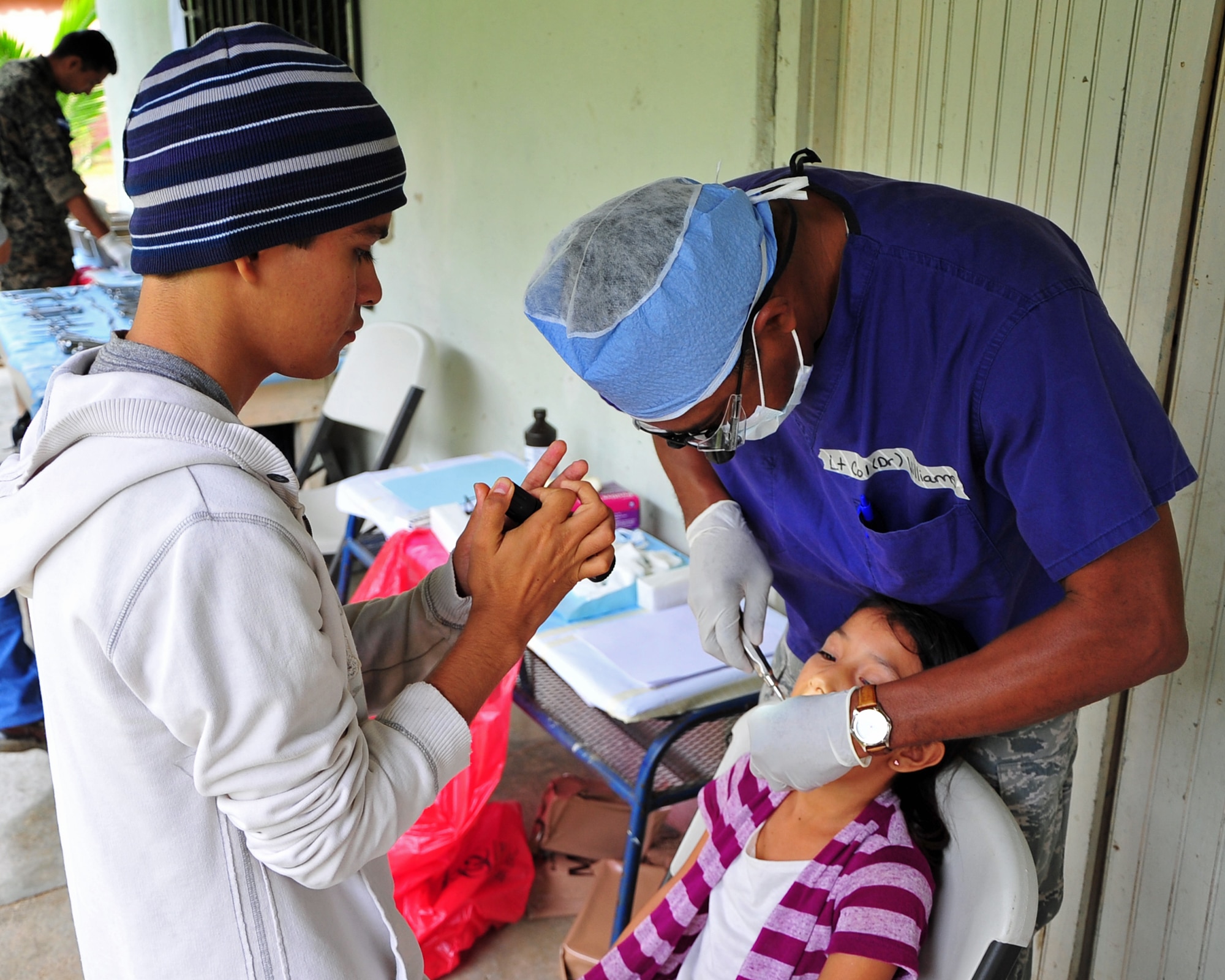 OLANCHO, Honduras – Lt. Col. Ray Williams, Medical Element dentist, extracts an adult molar from a La Bacadia community member during the Joint Medical Readiness Training Exercise with members from the Honduran Ministry of Health, the Honduran military and Joint Task Force-Bravo, Soto Cano Air Base, Feb. 1 here. The dental team preformed more than 300 extractions over the four days of the MEDRETE. (Air Force photo/Staff Sgt. Bryan Franks) 