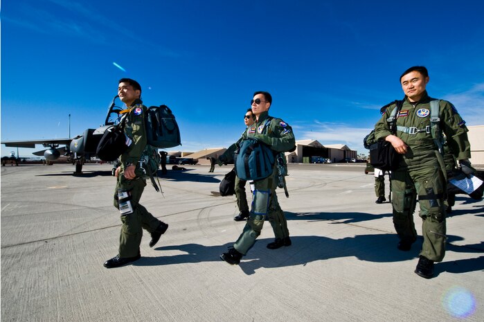 Republic of Korean Air Force pilots walk toward their F-15 Strike Eagles during Red Flag 12-2 Jan. 26, 2012, at Nellis Air Force Base, Nev. Red Flag is a realistic combat training exercise involving the air forces of the United States and its allies. The exercise is hosted north of Las Vegas on the Nevada Test and Training Range.  (U.S. Air Force photo by Staff Sgt. William P.Coleman)  