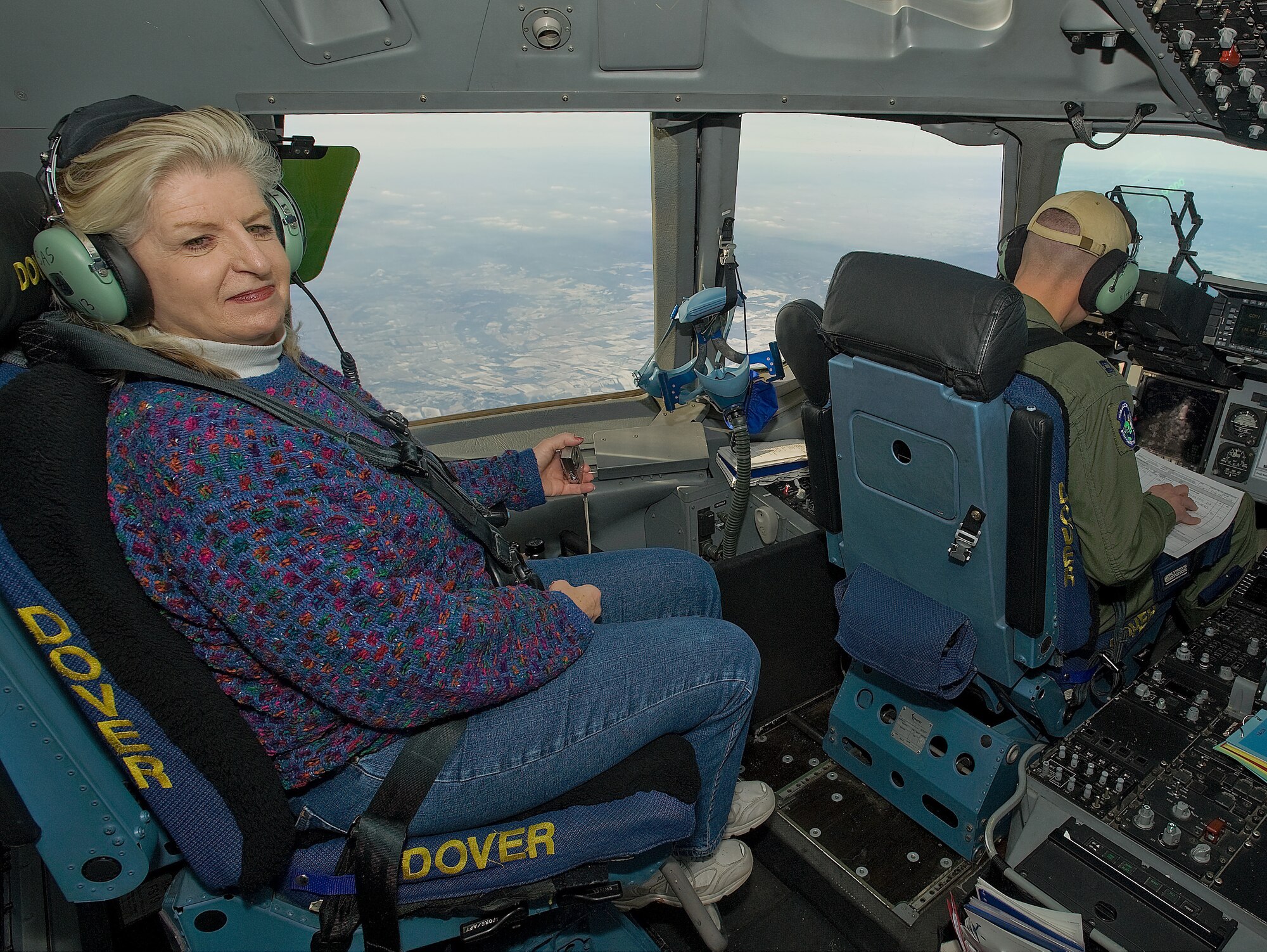 Janie Hibby, a member of Leadership Central Delaware, sits in the cockpit of a C-17 Globemaster III Jan. 25, 2012. Local community members were afforded the opportunity to partner with Team Dover for the LCD’s annual orientation flight. (U.S. Air Force photo by Airman 1st Class Samuel Taylor)
