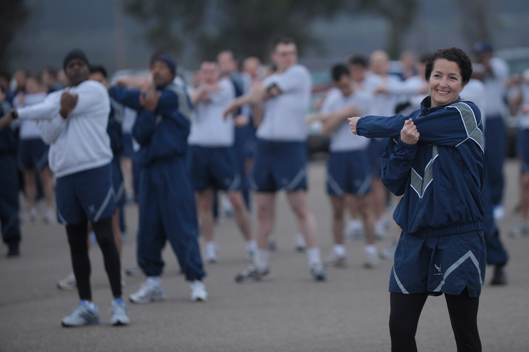 VANDENBERG AIR FORCE BASE, Calif. -- Col. Nina Armagno, 30th Space Wing commander, stretches with the wing during her first wing run as the new commander at the base parade grounds Tuesday, Jan. 31, 2012. Armango spoke about the importance of fitness. (U.S. Air Force photo/Staff Sgt. Andrew Satran) 

 