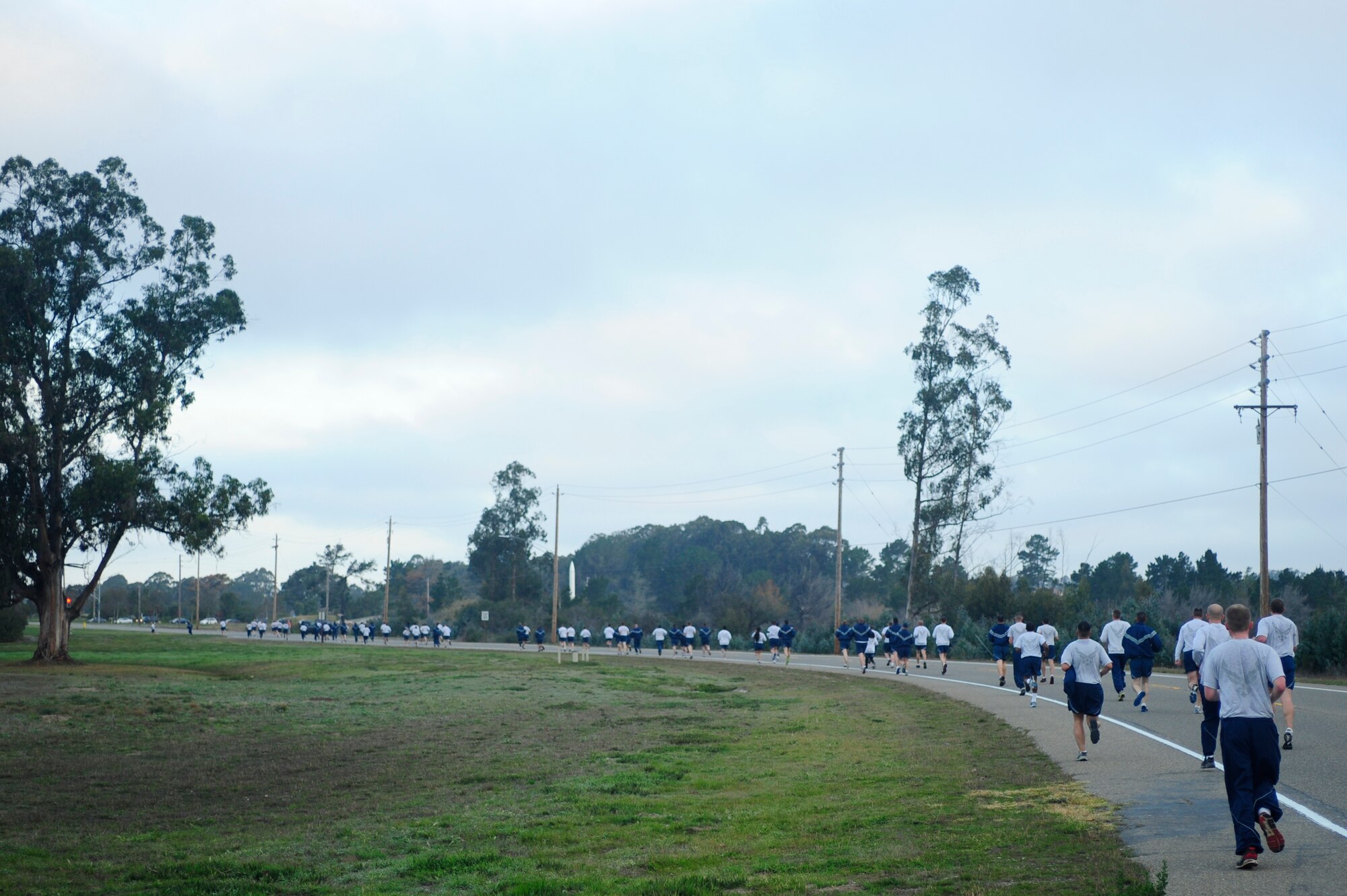 VANDENBERG AIR FORCE BASE, Calif. -- Approaching the finish line, members of the 30th Space Wing run the last stretch of the monthly Wing Run at the base parade grounds here Tuesday, Jan. 31, 2012. This was the first wing run for the wing's new commander, Col. Nina Armagno. (U.S. Air Force photo/Staff Sgt. Andrew Satran) 

 