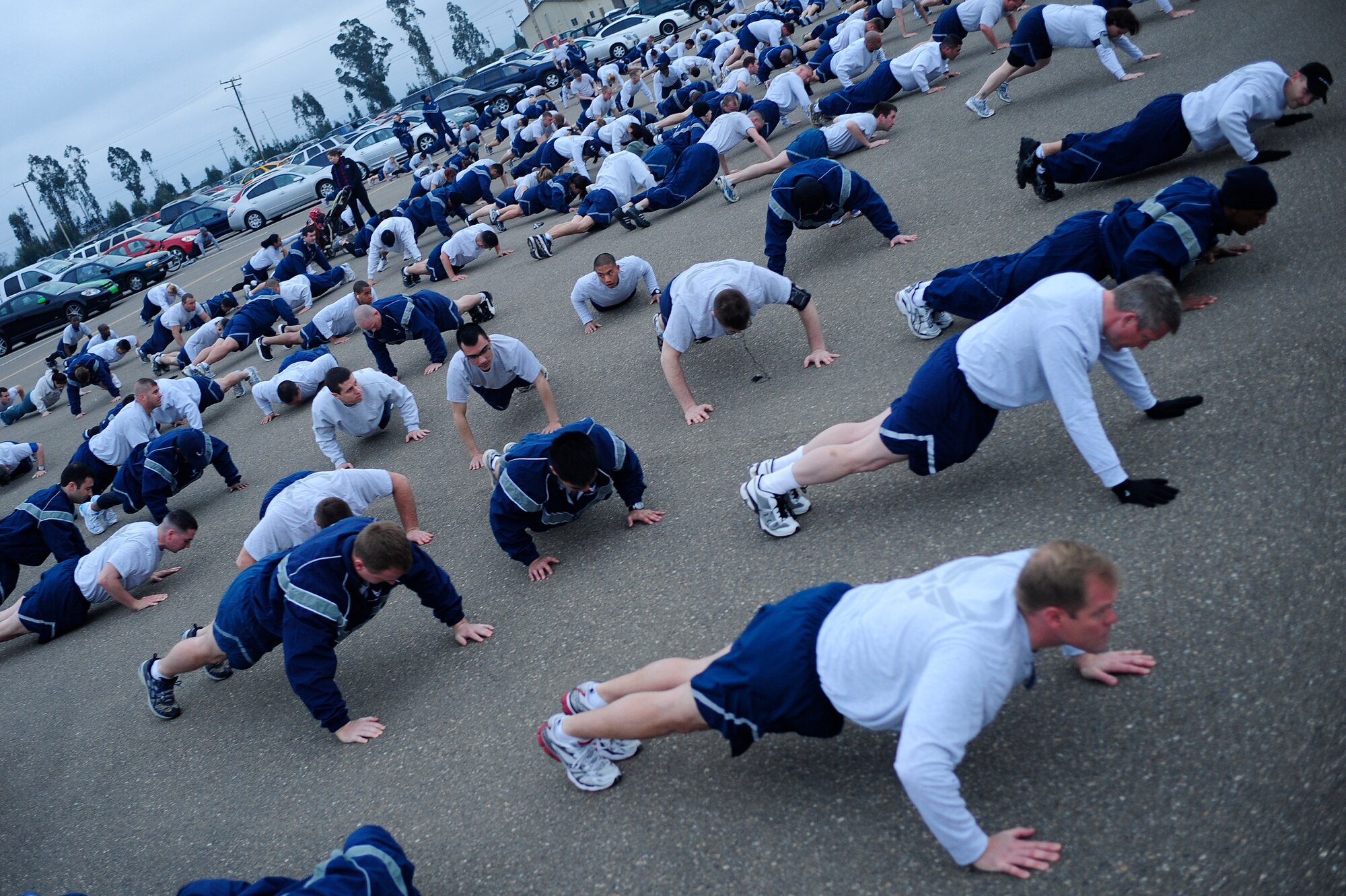 VANDENBERG AIR FORCE BASE, Calif. -- Members of the 30th Space Wing perform their warm-up drills before running in the monthly Wing Run at the base parade grounds here Tuesday, Jan. 31, 2012. This was the first Wing Run for the wing's new commander, Col. Nina Armagno. (U.S. Air Force photo/Staff Sgt. Andrew Satran)  

 