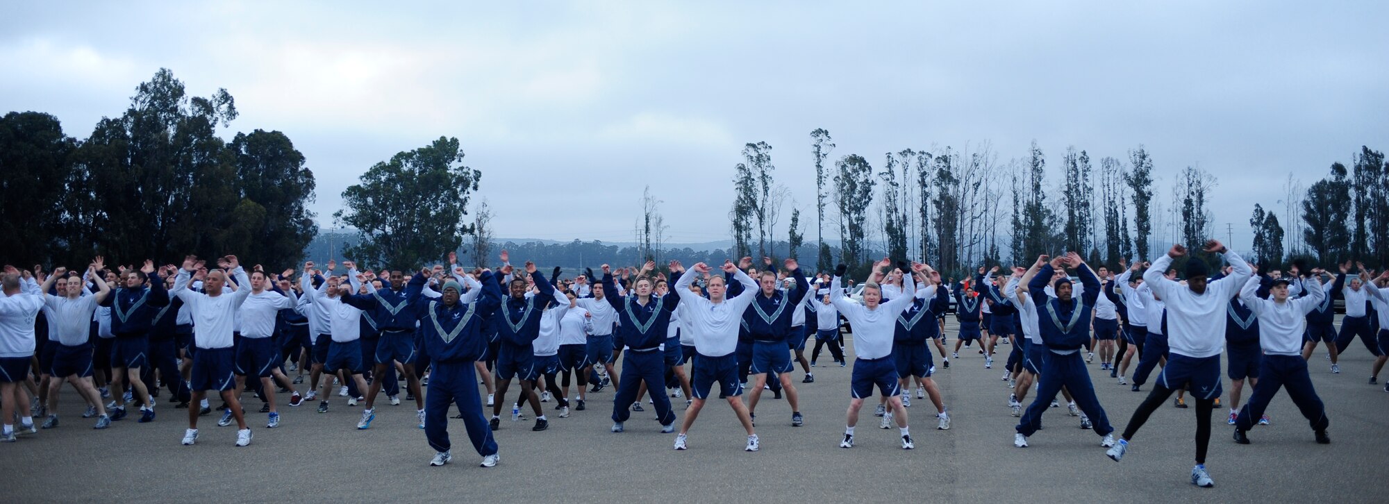 VANDENBERG AIR FORCE BASE, Calif. -- Members of the 30th Space Wing perform their warm-up drills before running in the monthly Wing Run at the base parade grounds here Tuesday, Jan. 31, 2012. (U.S. Air Force photo/Staff Sgt. Andrew Satran) 

 