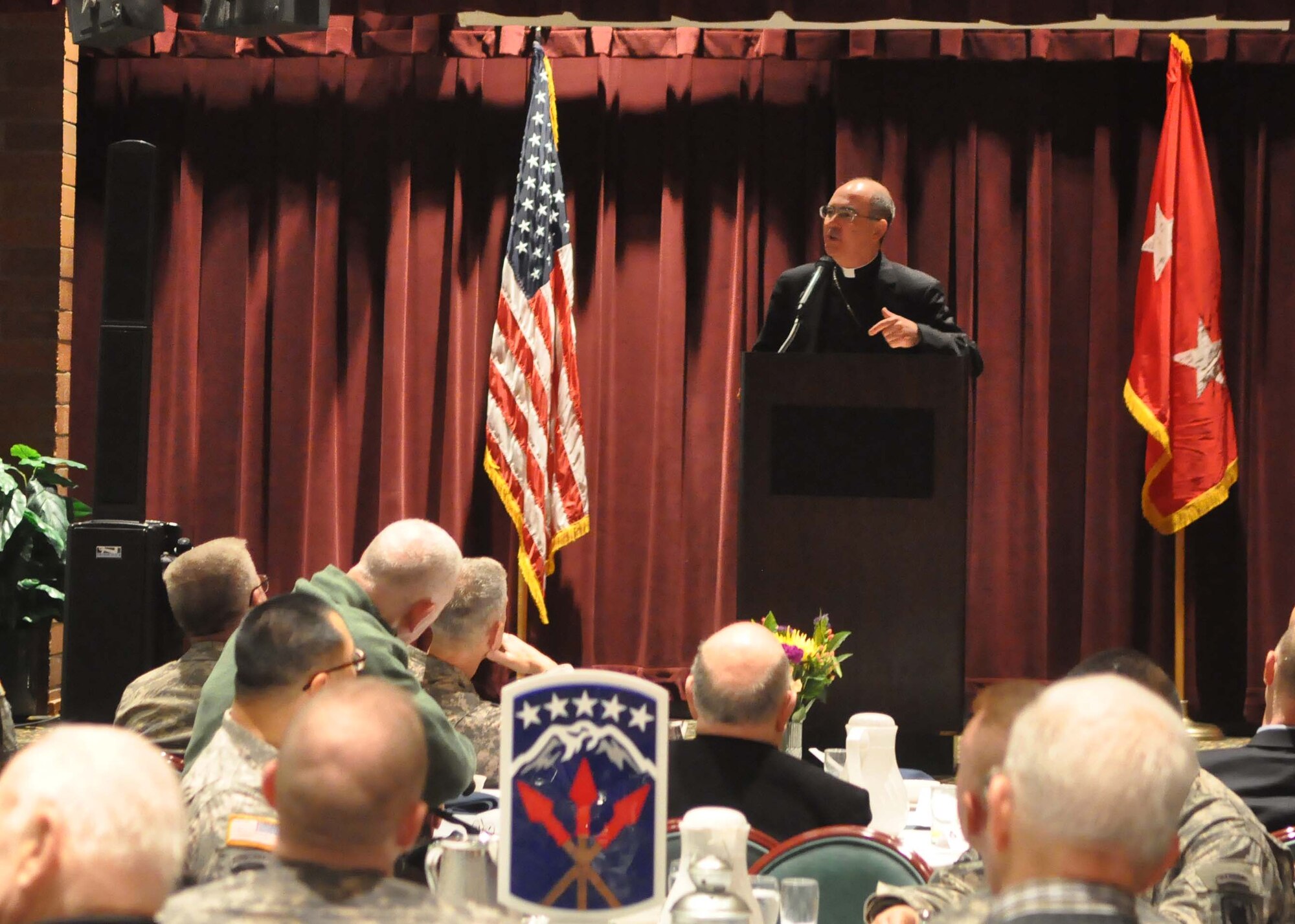 Archbishop J. Peter Sartain, Archbishop of Seattle, delivers the address as the guest speaker during the annual National Prayer Breakfast Feb. 1, 2012, at Joint Base Lewis-McChord, Wash. (U.S. Air Force photo/Airman 1st Class Leah Young)