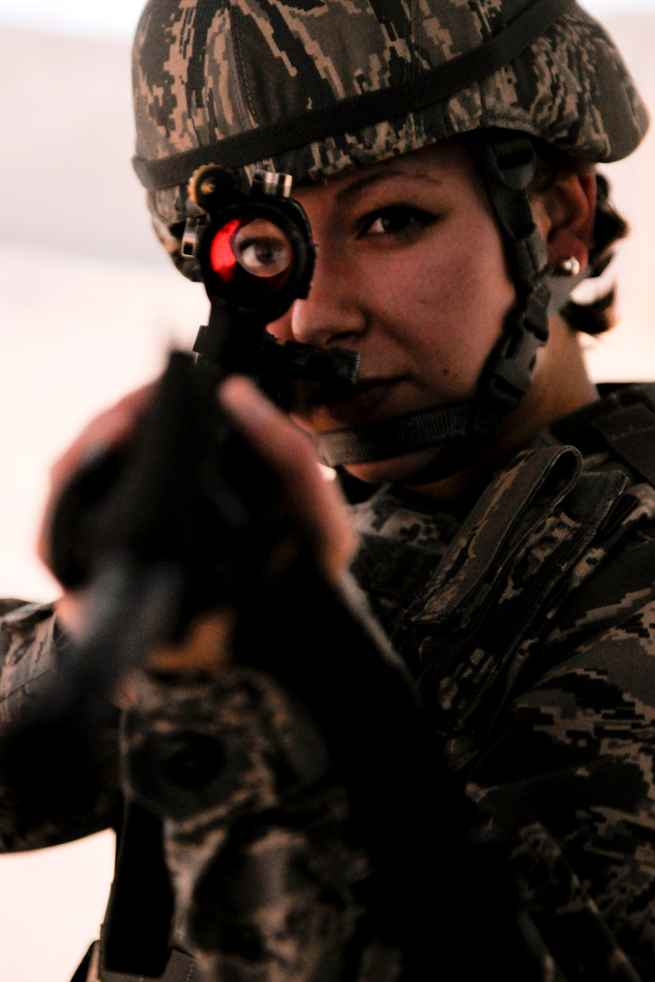 VANDENBERG AIR FORCE BASE, Calif. - Airman 1st Class Molly Shortt, a 30th Security Forces Squadron member, runs through a combat scenario in the firearms training simulator at the Combat Arms Training Complex (Building 21308) here Friday, Jan. 27, 2012. The new simulator provides a virtual training environment for Vandenberg members to practice real-world combat tactics and scenarios based on Air Force qualification courses. (U.S. Air Force/Staff Sgt. Levi Riendeau)

