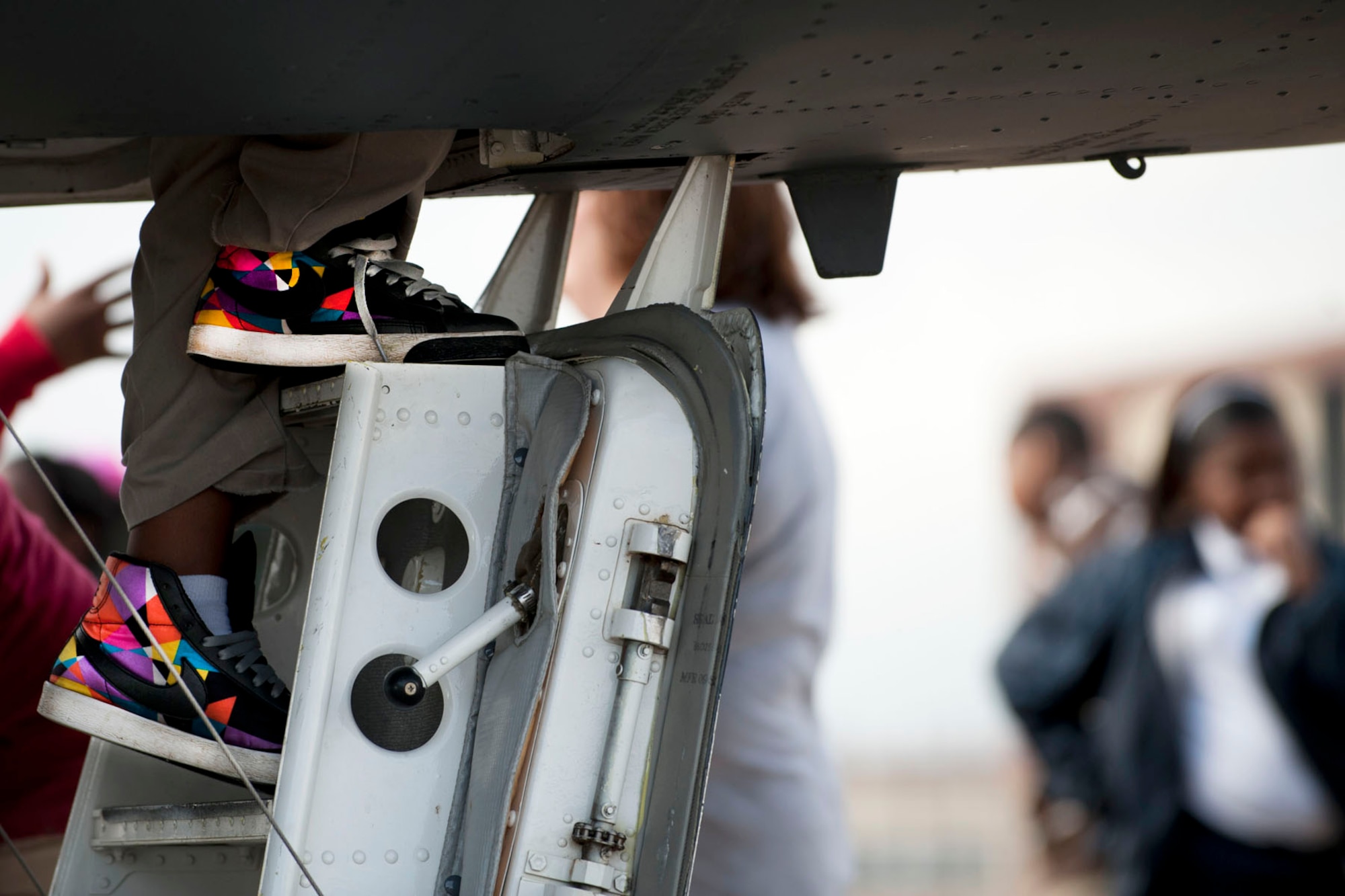 A STARBASE student makes his way up the hatch and into the cockpit of a B-52 bomber at Barksdale Air Force Base, La., Feb. 1, 2012. The Department of Defense STARBASE program provides students with 20-25 hours of stimulating experiences at National Guard, Navy, Marine, Air Force Reserve and Air Force bases across the nation. (U.S. Air Force photo by Master Sgt. Greg Steele/Released)