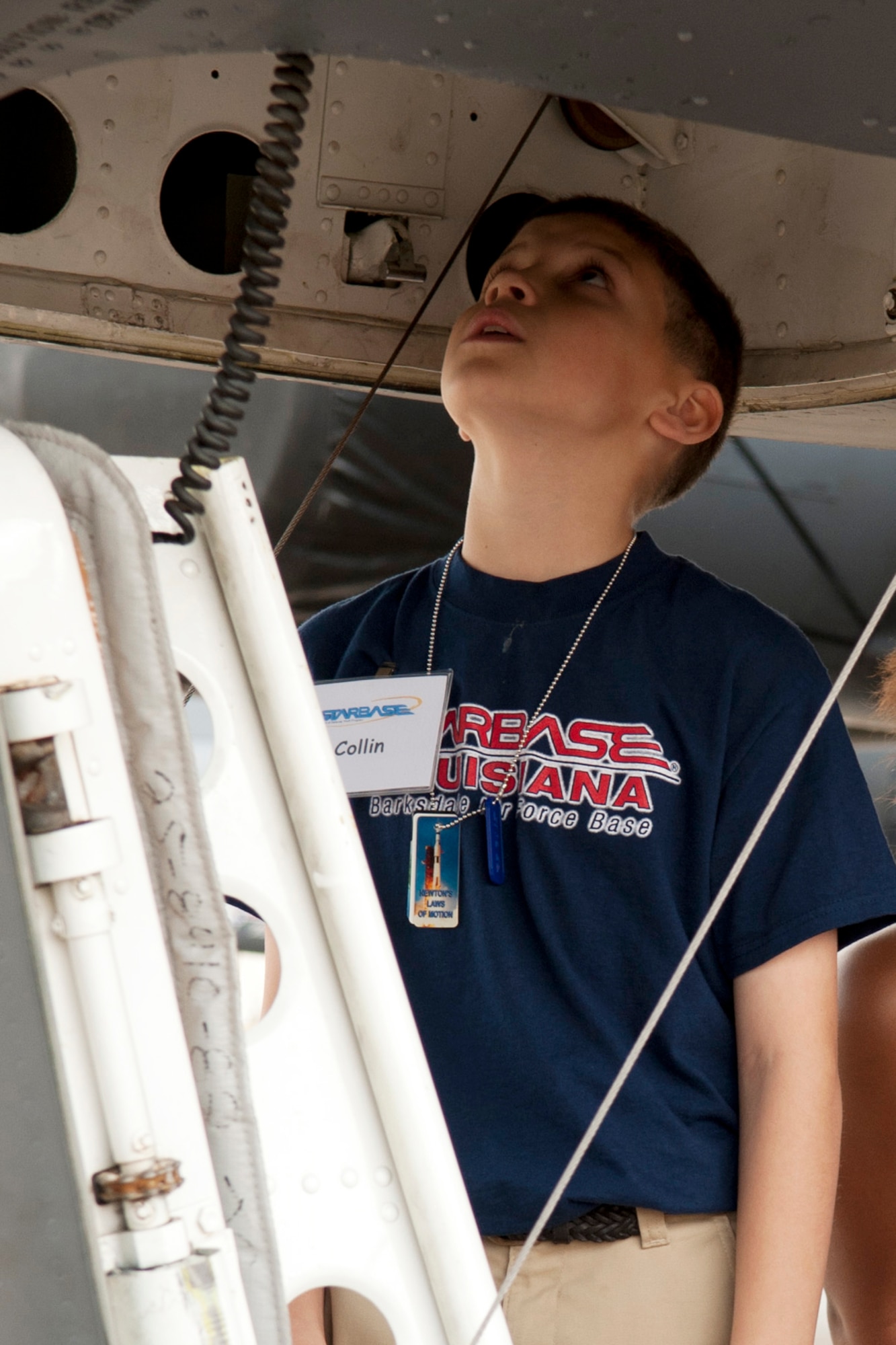 A STARBASE student waits for his turn to climb into the cockpit of a 93rd Bomb Squadron B-52 Stratofortress during a tour at Barksdale Air Force Base, La., Feb. 1, 2012. Department of Defense STARBASE is a premiere educational program that provides local area students with 20-25 hours of stimulating experiences at National Guard, Navy, Marine, Air Force Reserve and Air Force bases across the nation. (U.S. Air Force photo by Master Sgt. Greg Steele/Released)
