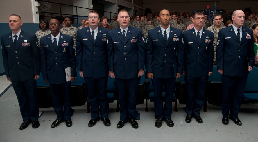 U.S. Air Force Airmen stand at attention after a promotion ceremony at Moody Air Force Base Ga., Jan. 31, 2012.  Promotees stand at attention to be recognized by fellow Airmen in attendance for earning their new rank. (U.S. Air Force Photo by Airmen 1st Class Paul Francis/Released)
