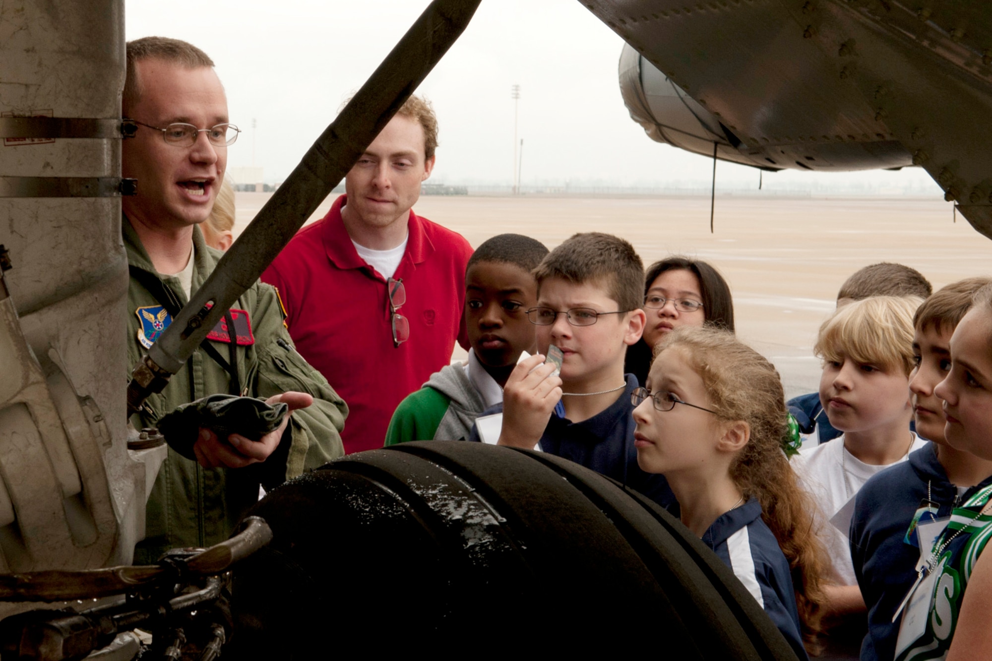 U.S. Air Force Capt. Kris Hollenback, 96th Bomb Squadron electronic warfare officer, talks about the B-52 bomber to a group of STARBASE students, Barksdale Air Force Base, La., Feb. 1, 2012. The students interact with military personnel to explore careers and observe Science, Technology, Engineering and Math applications in the "real world". (U.S. Air Force photo by Master Sgt. Greg Steele/Released)