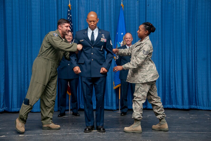 U.S. Air Force Tech. Sgt. Curt Mitchell, 23rd Wing ground safety, is promoted to the rank of E-6 at Moody Air Force Base Ga., Jan. 31, 2012. It is an Air Force tradition to have the stripes punched after promotion as a sign of solidity. (U.S. Air Force Photo by Airmen 1st Class Paul Francis/Released)

