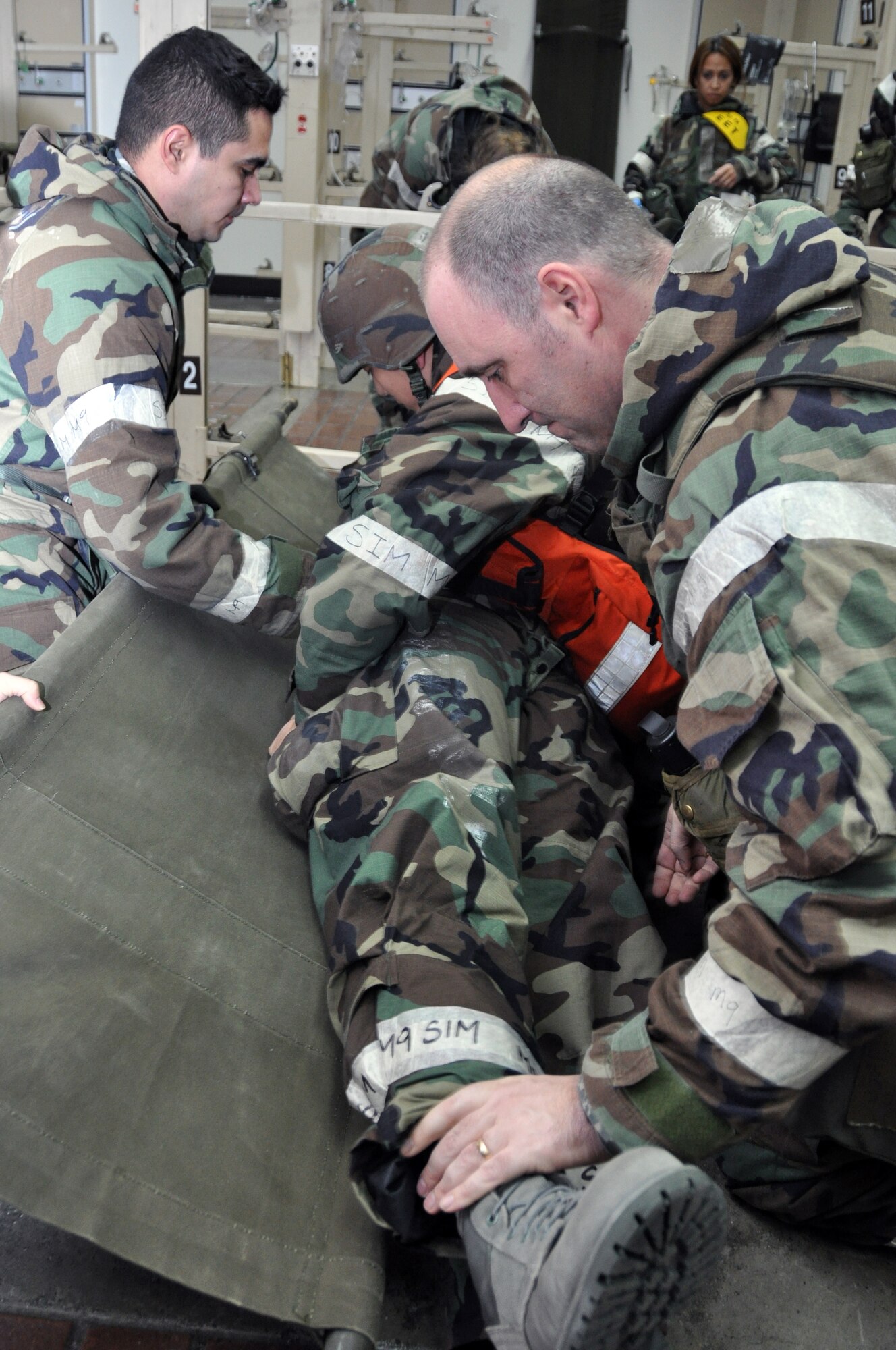Members of the 51st Medical Group process and treat patients after an attack from opposing forces Feb. 1, 2012, during Beverly Bulldog 12-10 at Osan Air Base, Republic of Korea. Beverly Bulldog 12-01 is the first operational readiness exercise executed in Korea for 2012. (U.S. Air Force photos/ Airman 1st Class Michael Battles)