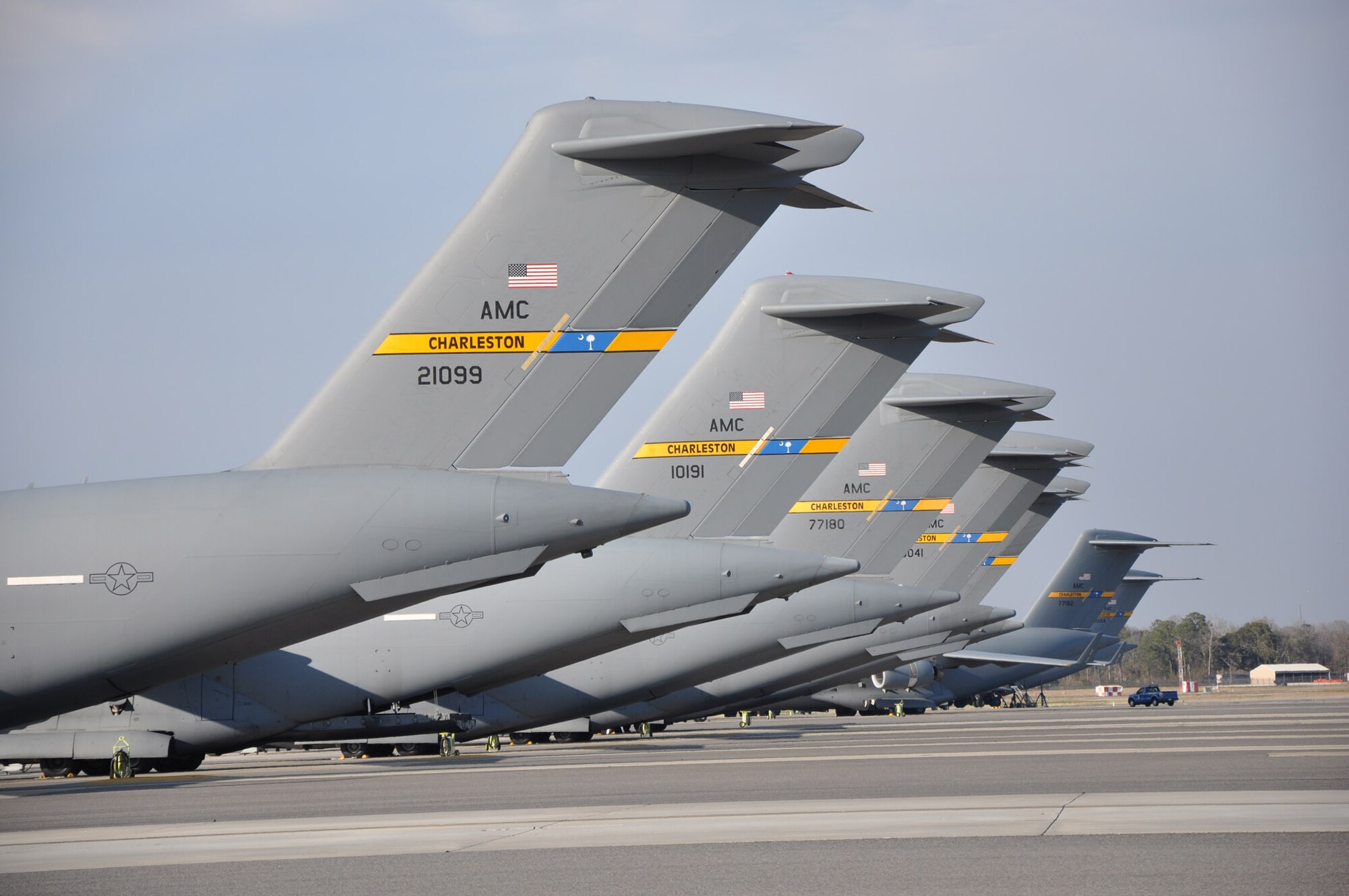 56 C-17 Globemaster III aircraft assigned to Joint Base Charleston, S.C., park along the flightline awaiting crew and supplies before performing their mission. (U.S. Air Force photo by 1st Lt. Joseph Simms)