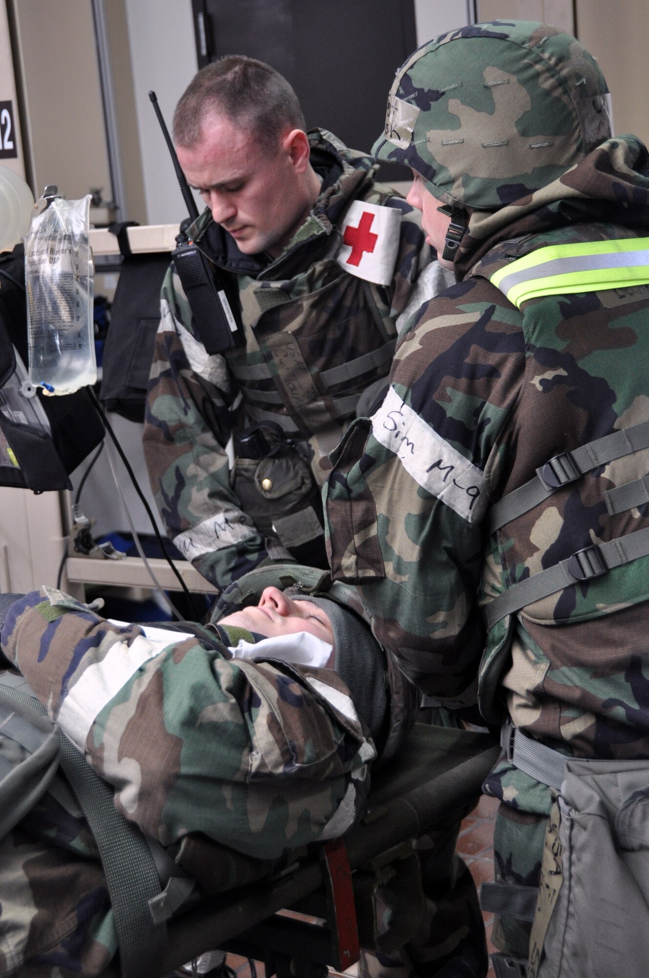 Members of the 51st Medical Group process and treat patients after a simulated attack from opposing forces, Feb. 1, 2012, during Beverly Bulldog 12-10 at Osan Air Base, Republic of Korea. BB 12-01 is the first operational readiness exercise executed in Korea for 2012. (U.S. Air Force photos/ Airman 1st Class Michael Battles)