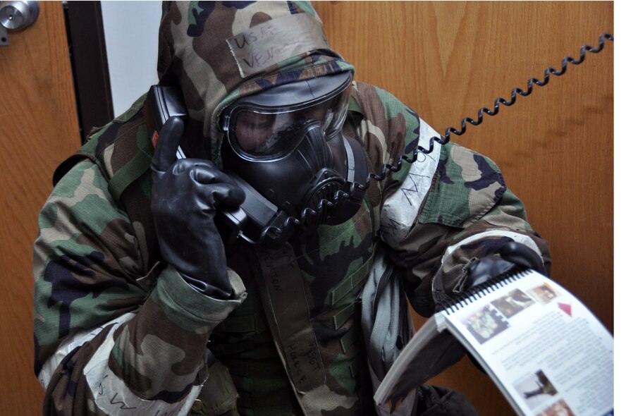 Master Sgt. Venton Horrice, 51st Medical Operations Squadron, references the Airman’s Manual while calling in a possible active shooter Feb. 1, 2012, during operational readiness exercise Beverly Bulldog 12-01 at Osan Air Base, Republic of Korea. (U.S. Air Force photo/Airman 1st Class Michael Battles)