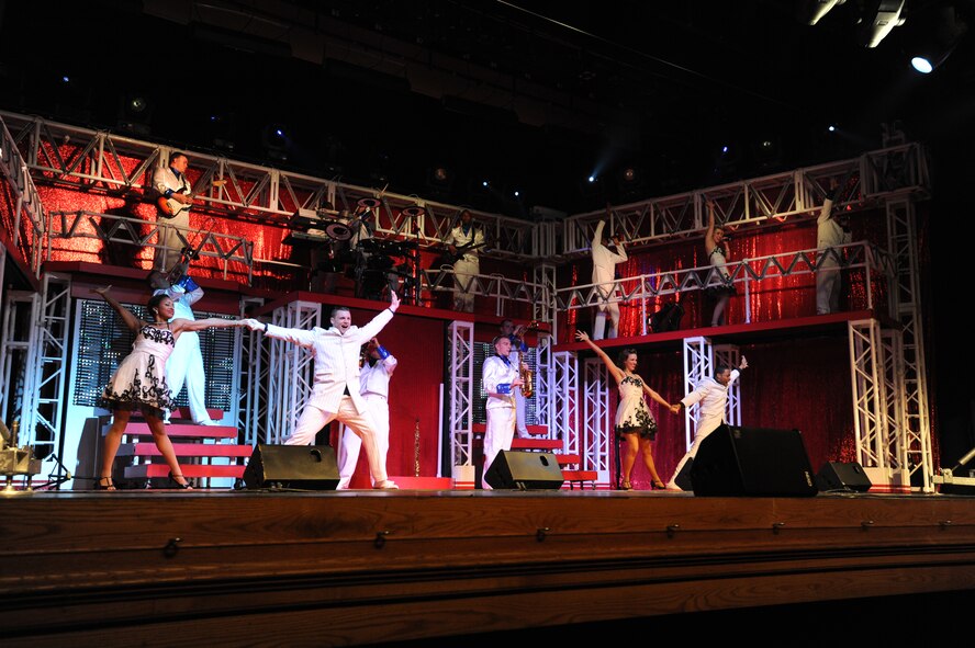 U.S. Air Force Tops in Blue members dance and sing during a performance Jan. 31, 2012, Patriot Hall, Sumter, S.C. The 2011 Tops in Blue tour, entitled “Rhythm Nation,” brings to life American music from the early 1900s through today. (U.S. Air Force photo by Airman 1st Class Tabatha McCarthy/Released)