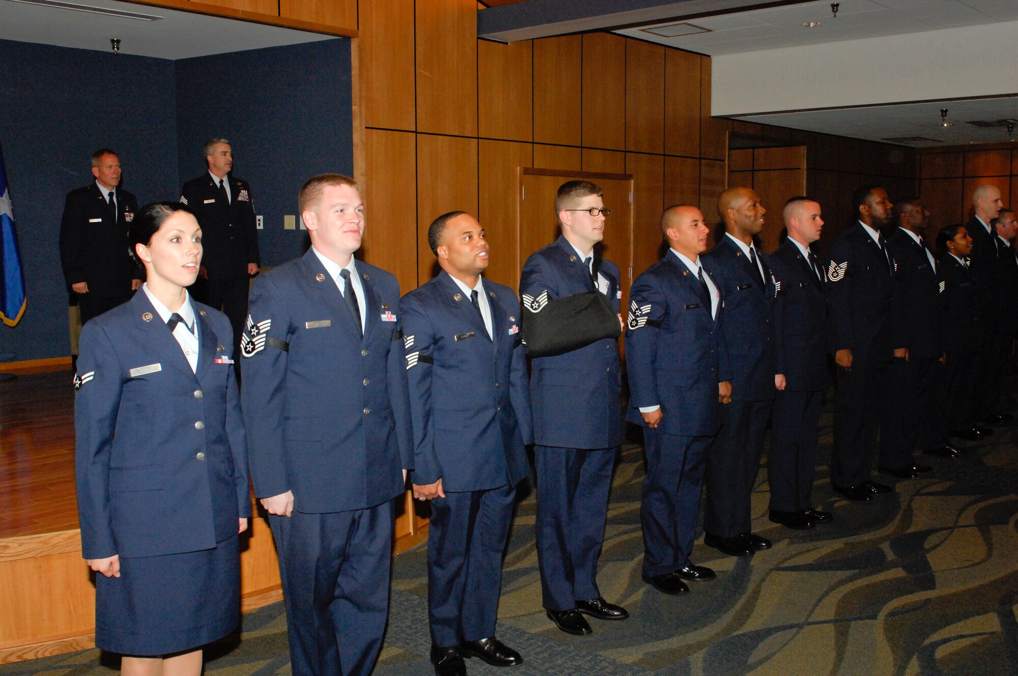 Tyndall’s newest promotes sing the Air Force at the conclusion of the monthly wing promotion party Jan. 31 at Horizons. (U.S. Air Force photo by Chris Coeking)