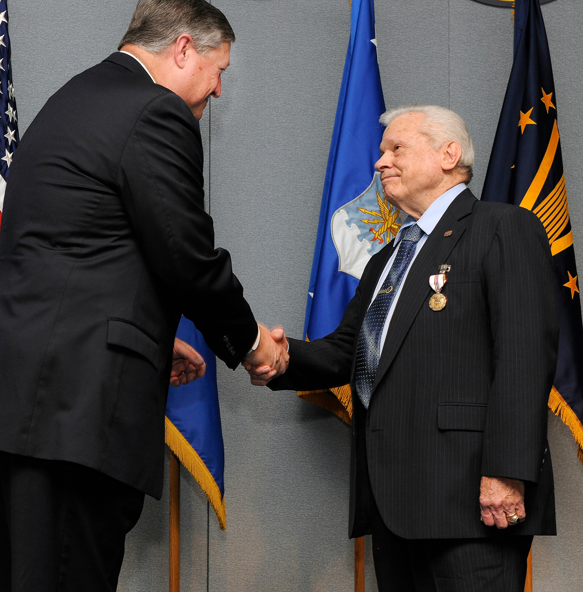 Secretary of the Air Force Michael Donley thanks Joe Lineberger, the Air Force Review Boards Agency director, for his service during his retirement ceremony Jan. 31, 2012, at Joint Base Andrews, Md.     (U.S. Air Force photo/Scott M. Ash)