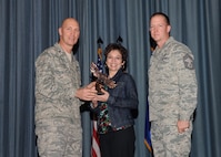 The fourth-quarter Joint Base San Antonio-Randolph award winners were recognized during an awards ceremony at the base theater Jan. 31.  Brig. Gen. Tim Zadalis, Air Education and Training Command director of intelligence, operations and nuclear integration, on left, and Chief Master Sgt. Charles Meyer, AETC chief of safety, right, present the Non-Supervisor Civilian Category II of the Quarter Award to Pamela Long from the Air Force Personnel Operations Agency.  (U.S. Air Force photo/Melissa Peterson)