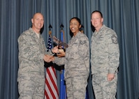 The fourth-quarter Joint Base San Antonio-Randolph award winners were recognized during an awards ceremony at the base theater Jan. 31.  Brig. Gen. Tim Zadalis, Air Education and Training Command director of intelligence, operations and nuclear integration, on left, and Chief Master Sgt. Charles Meyer, AETC chief of safety, right, present the NCO of the Quarter Award Award to Staff Sgt. Andria King from the 359th Medical Group.  (U.S. Air Force photo/Melissa Peterson)