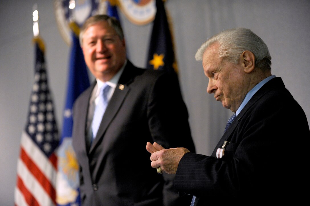 Secretary of the Air Force Michael Donley praises the career accomplishments of Joe Lineberger, the Air Force Review Boards Agency director, during his retirement ceremony Jan. 31, 2012, at Joint Base Andrews, Md.   (U.S. Air Force photo/Scott M. Ash)