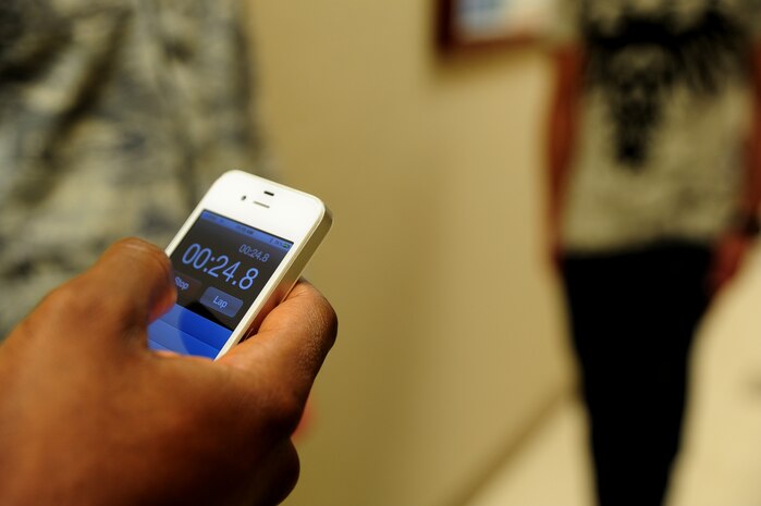 Senior Airman Chris Bryant times Petty Officer 2nd Class Bradley Nguyen while he performs the one-leg-stand test during the standardized field sobriety testing course at Joint Base Charleston – Air Base, Jan. 23-26. 628th Security Forces Squadron members participated in the four day course which is designed to train and certify law enforcement officials to use driving under the influence detection techniques and national standardized field sobriety tests.  Bryant is a law enforcement officer and Nguyen is a Master-at-Arms. Both are assigned to the 628th SFS.  (U.S. Air Force photo/ Staff Sgt. Nicole Mickle)  